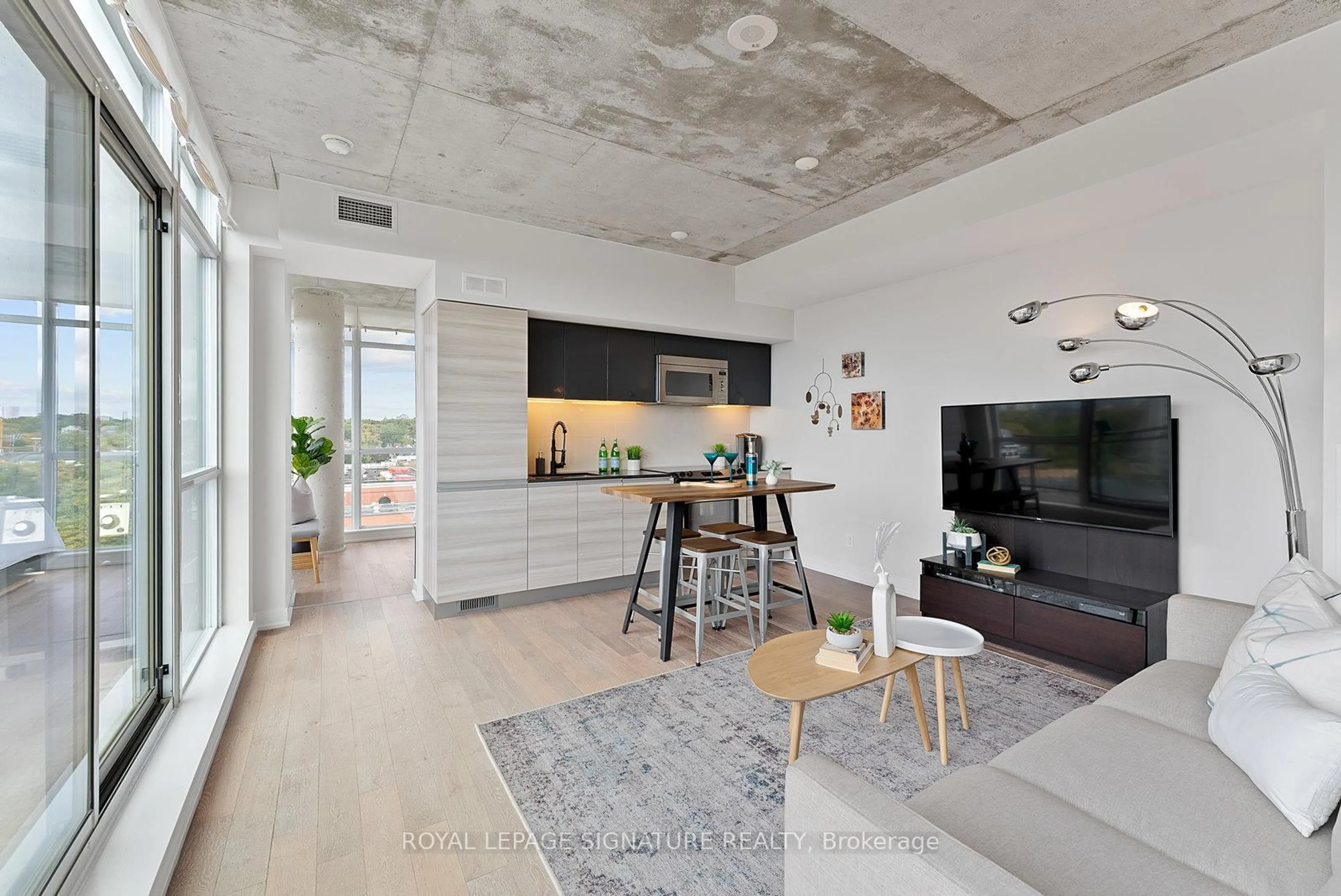 Open concept kitchen, cement floor for 1190 Dundas St #1021, Toronto Ontario M4M 0C5