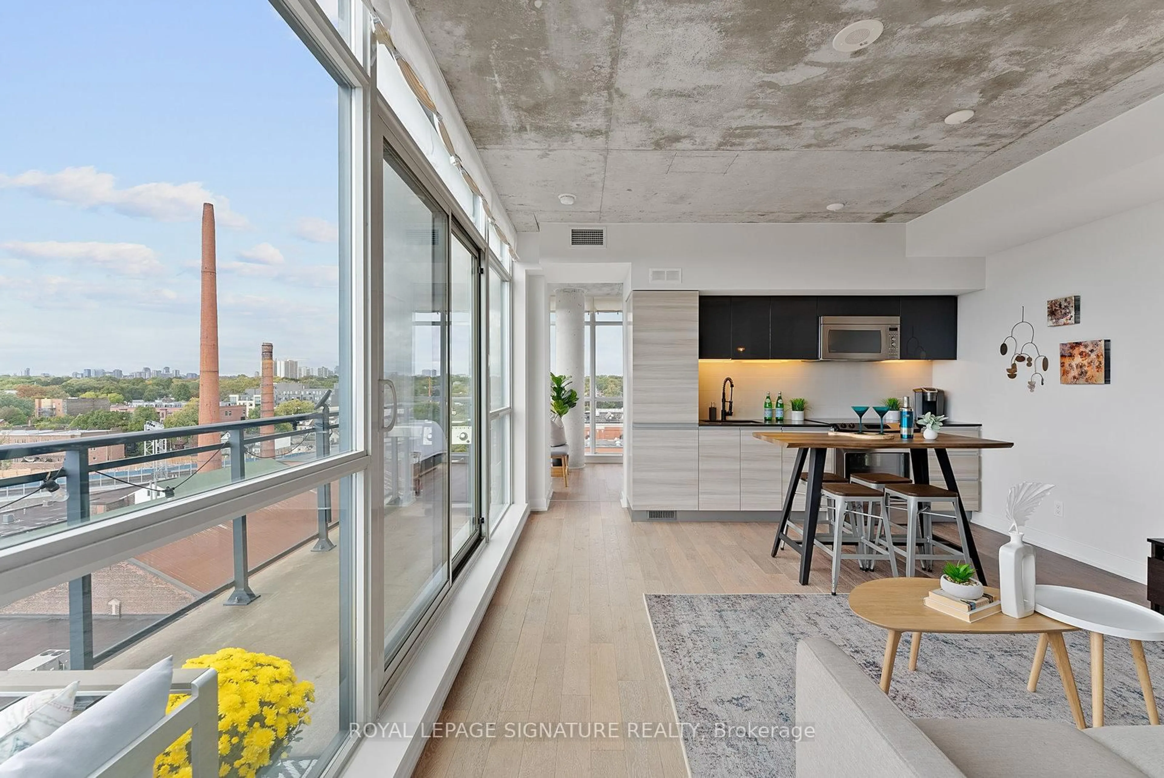 Open concept kitchen, cement floor for 1190 Dundas St #1021, Toronto Ontario M4M 0C5
