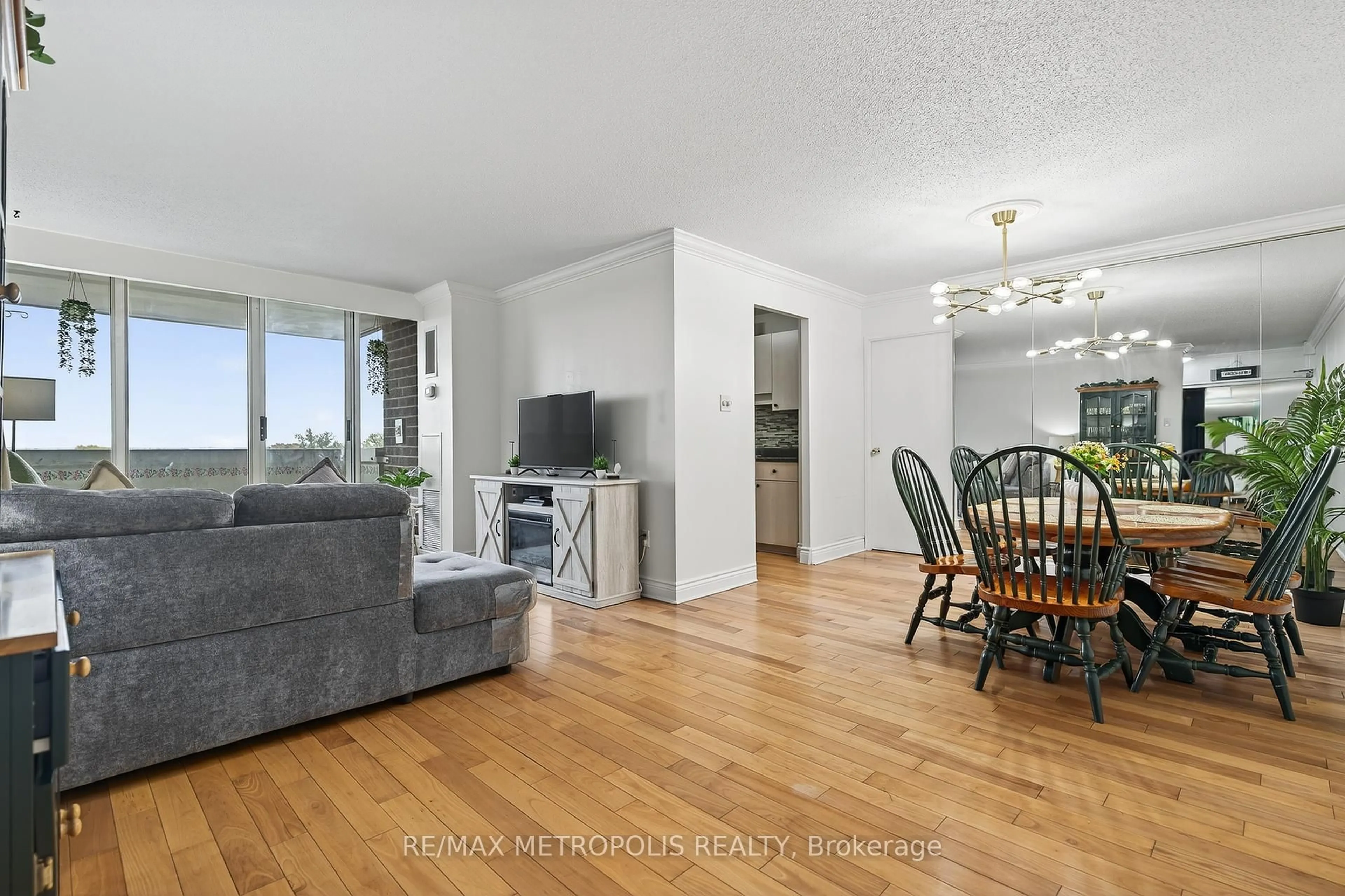 Living room with furniture, wood/laminate floor for 44 Falby Crt #707, Ajax Ontario L1S 3L1