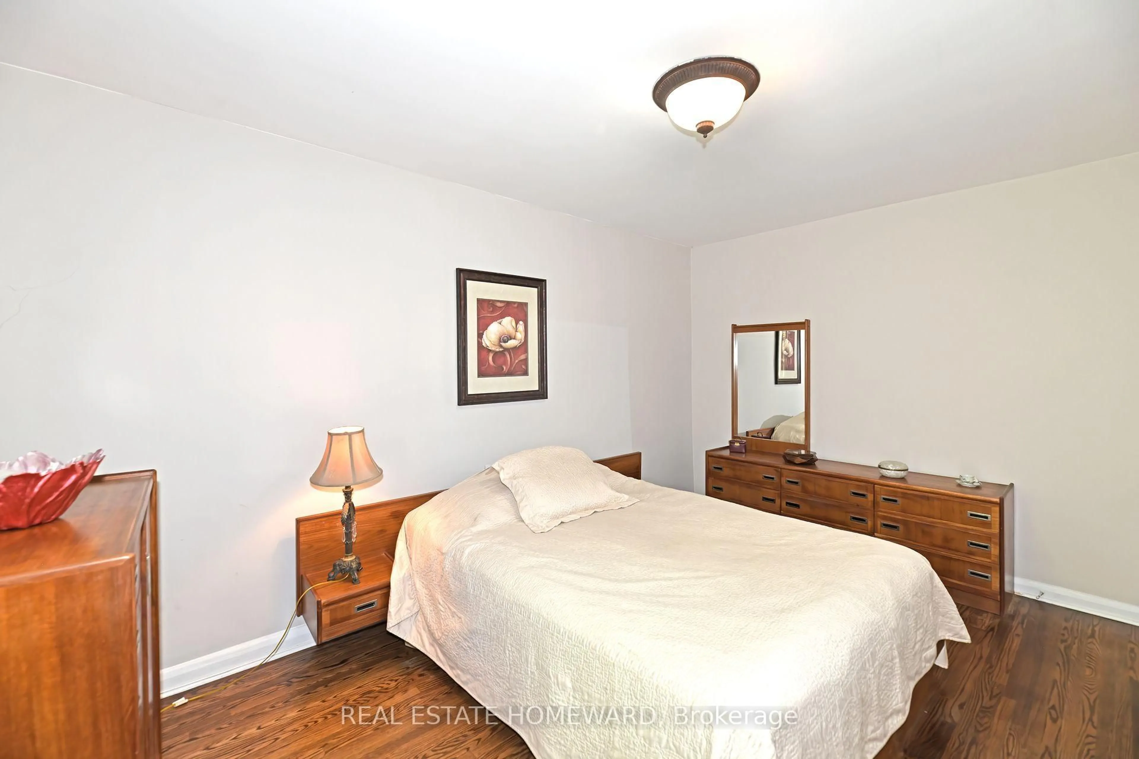 Bedroom with bed, wood/laminate floor for 9 Red Deer Ave, Toronto Ontario M1N 2Y6