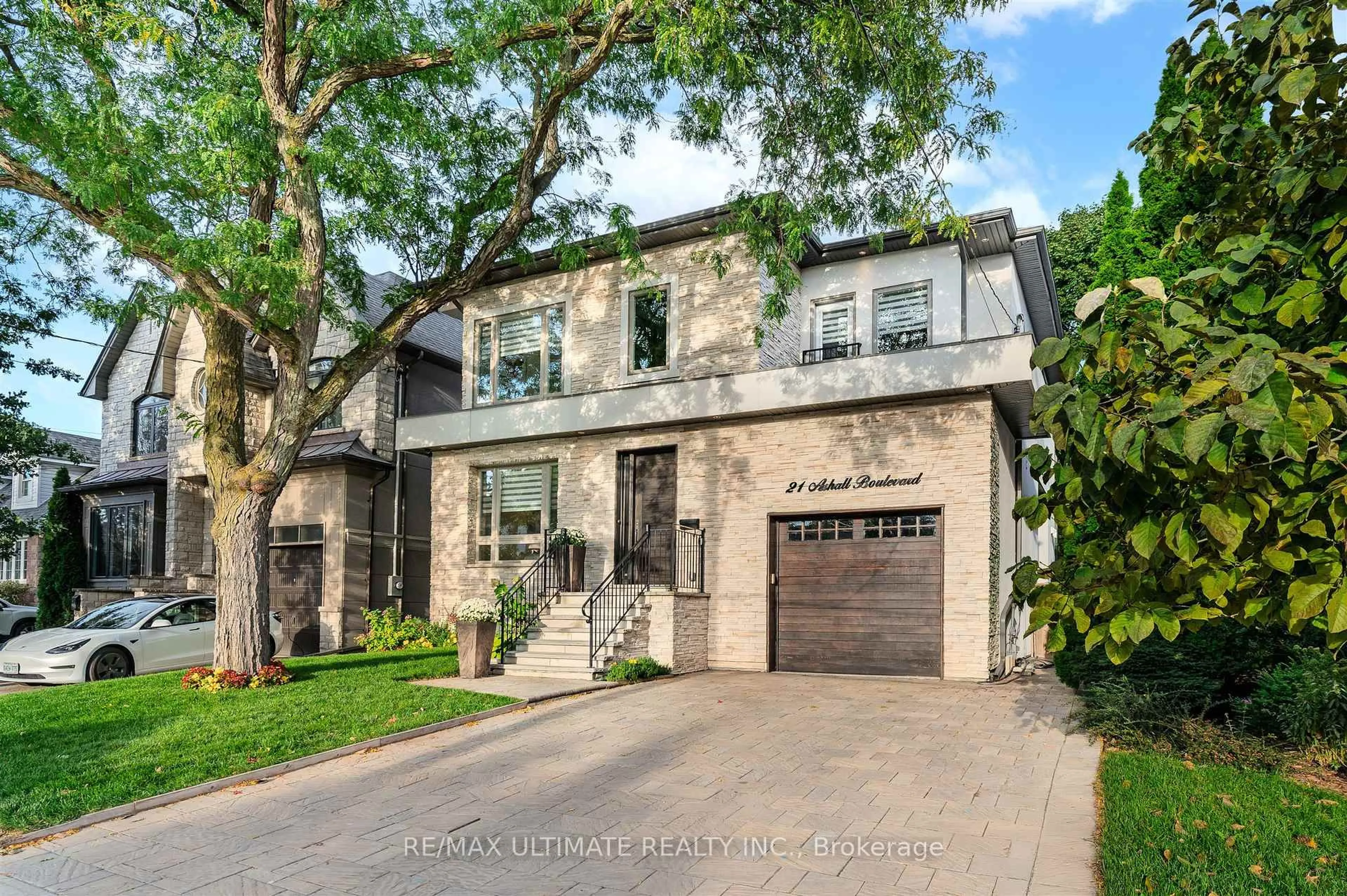 Home with brick exterior material, street for 21 Ashall Blvd, Toronto Ontario M4B 3C2