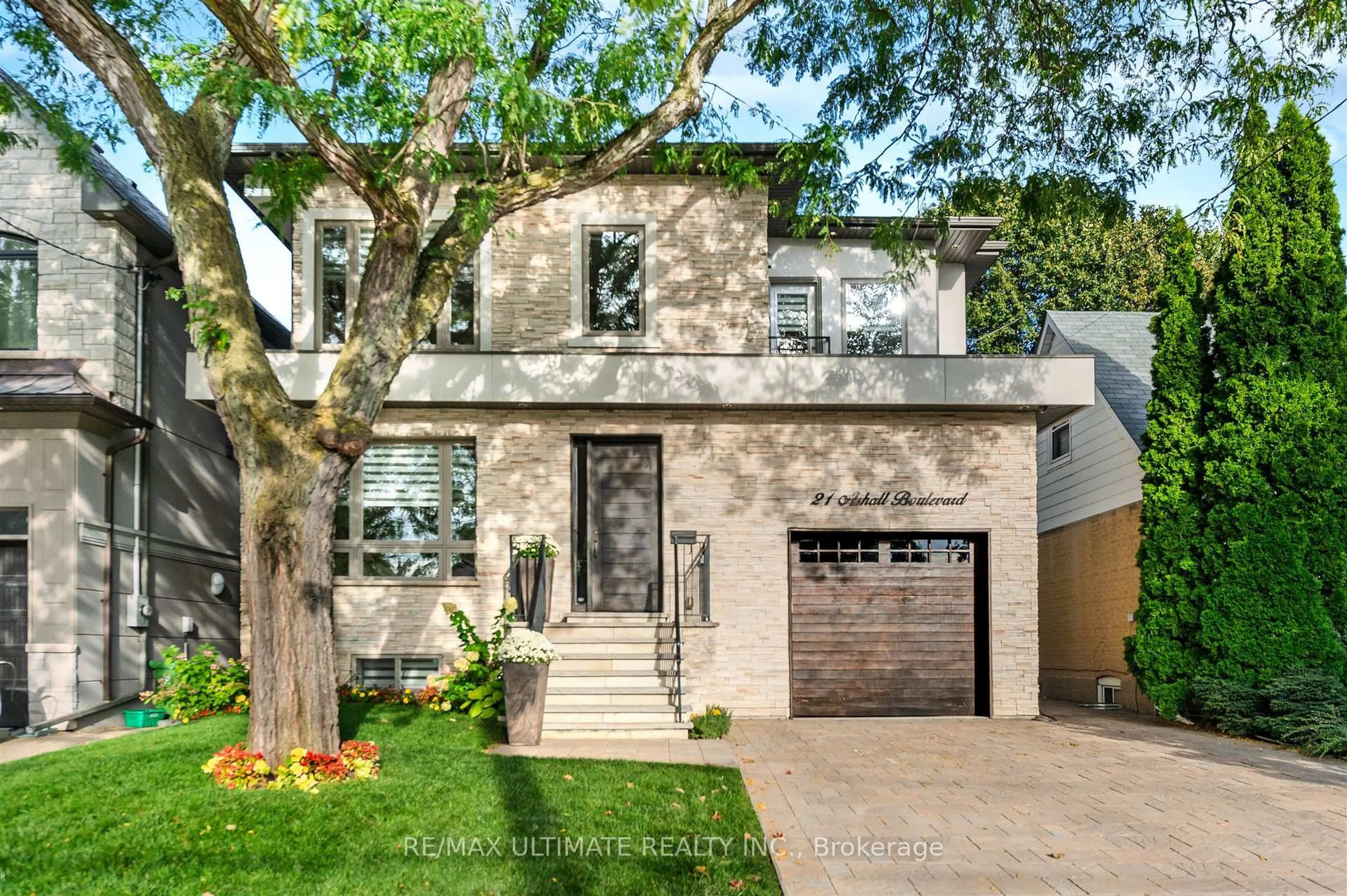 Home with brick exterior material, street for 21 Ashall Blvd, Toronto Ontario M4B 3C2