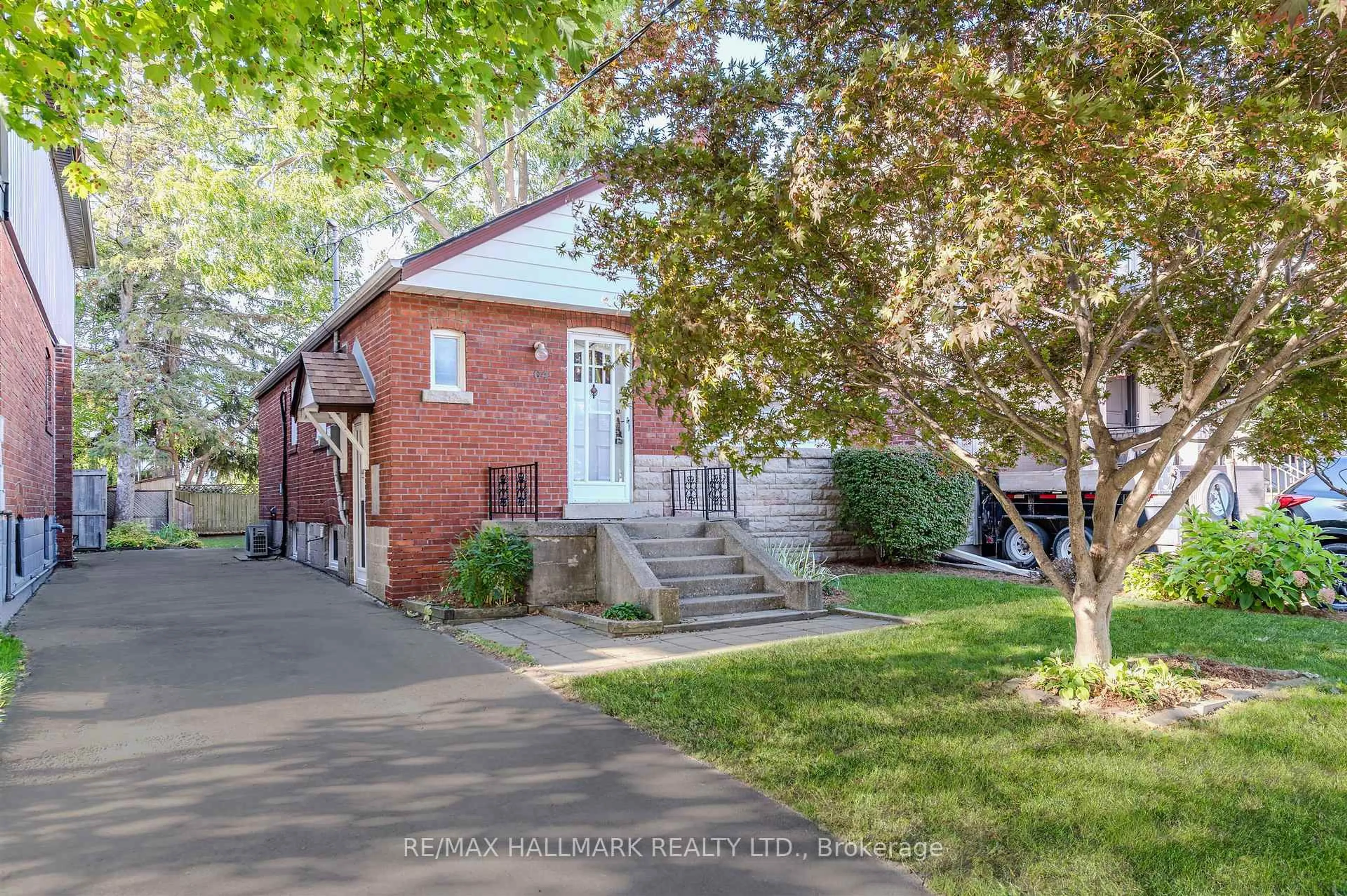 Home with brick exterior material, street for 64 Denvale Rd, Toronto Ontario M4B 3B8