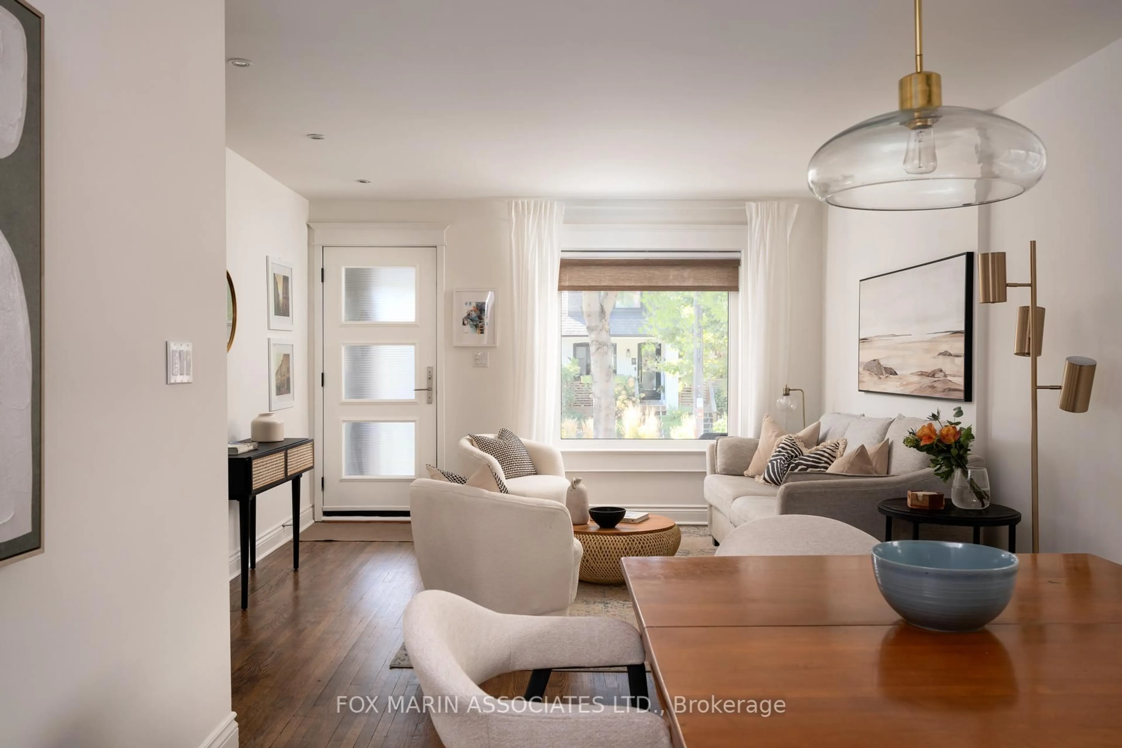 Living room with furniture, wood/laminate floor for 29 Hiltz Ave, Toronto Ontario M4L 2N6