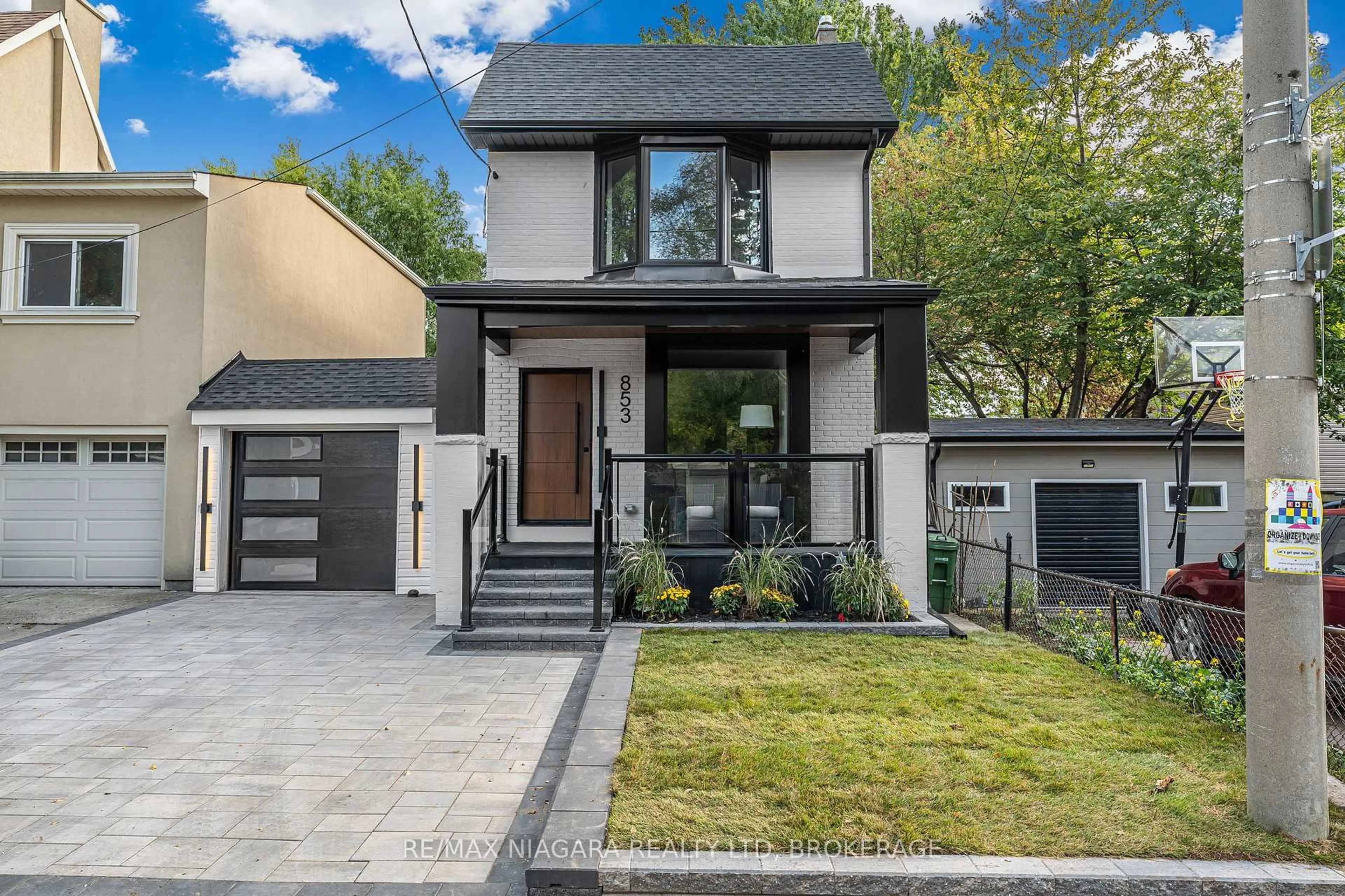 Home with brick exterior material, street for 853 Sammon Ave, Toronto Ontario M4C 2E9