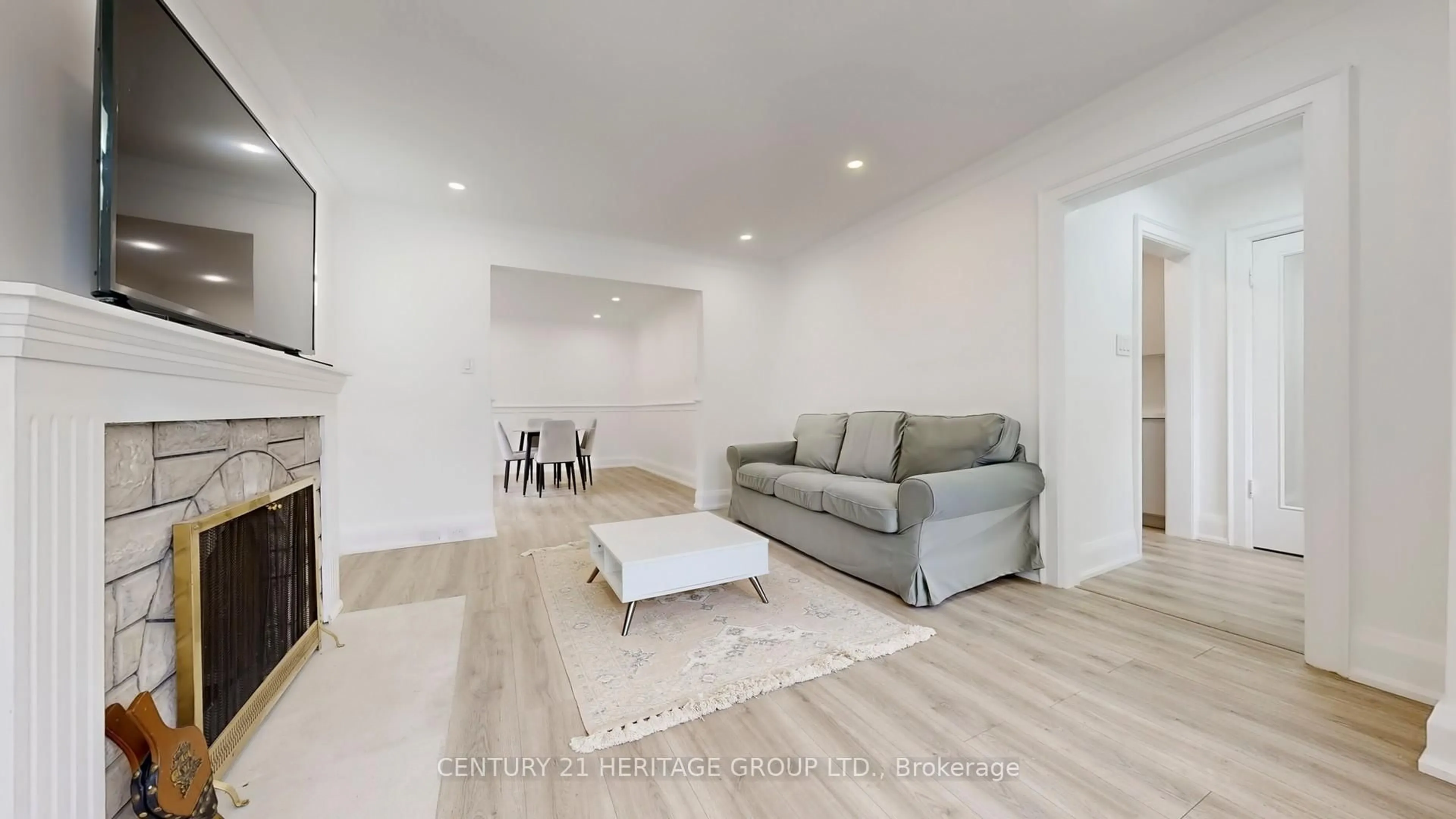 Living room with furniture, wood/laminate floor for 226 Donlands Ave, Toronto Ontario M4J 3R2