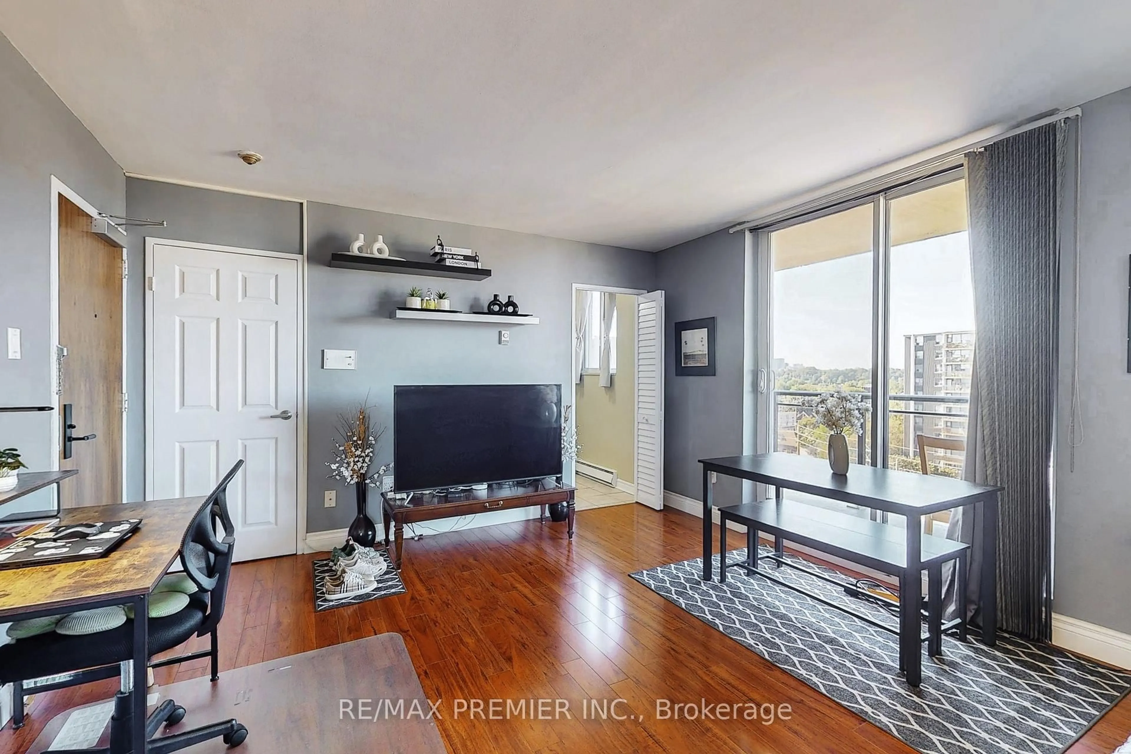 Living room with furniture, wood/laminate floor for 1145 Logan Ave #1001, Toronto Ontario M4K 3G9