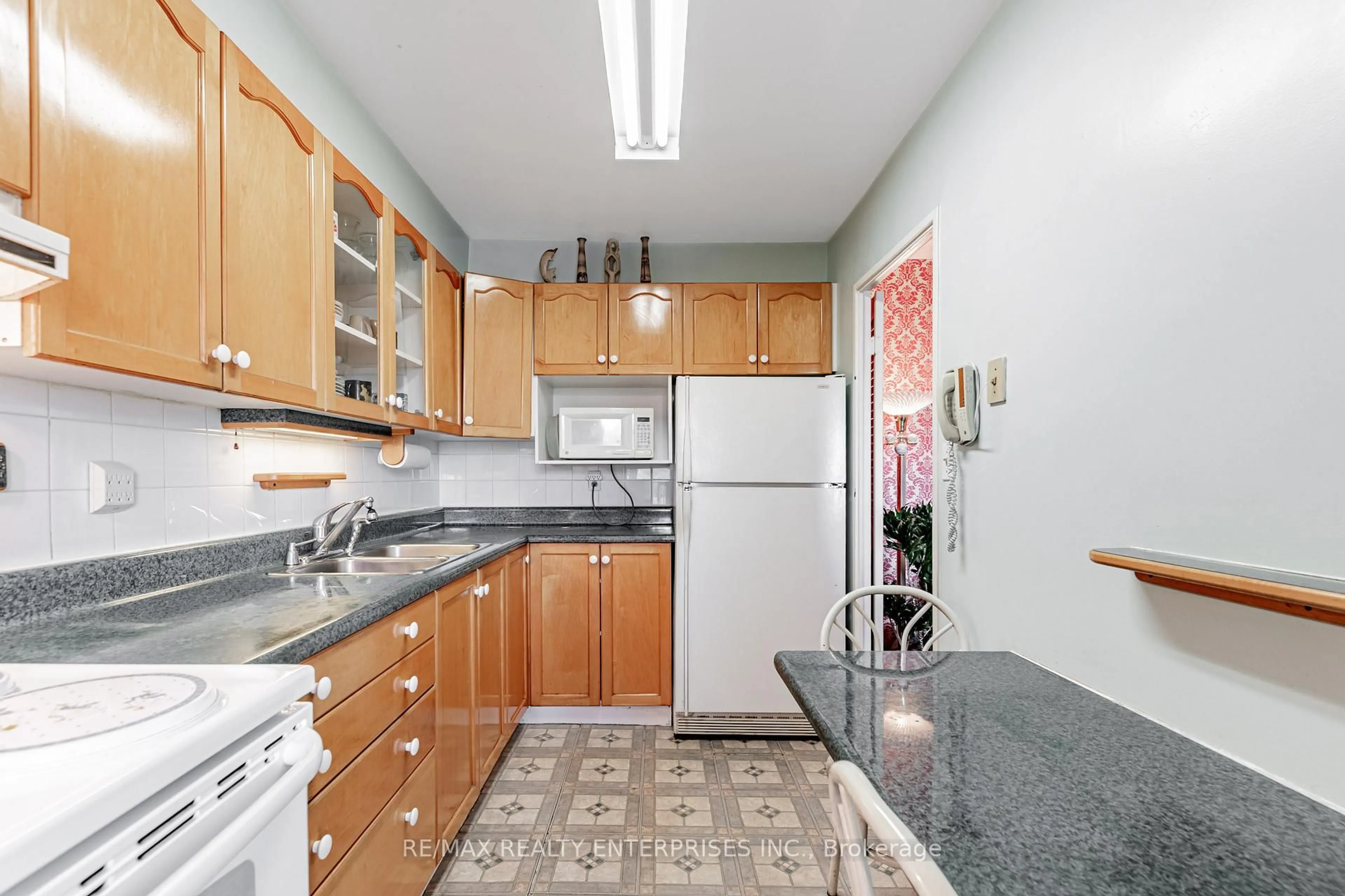 Standard kitchen, unknown for 1 Massey Sq #308, Toronto Ontario M4C 5L4