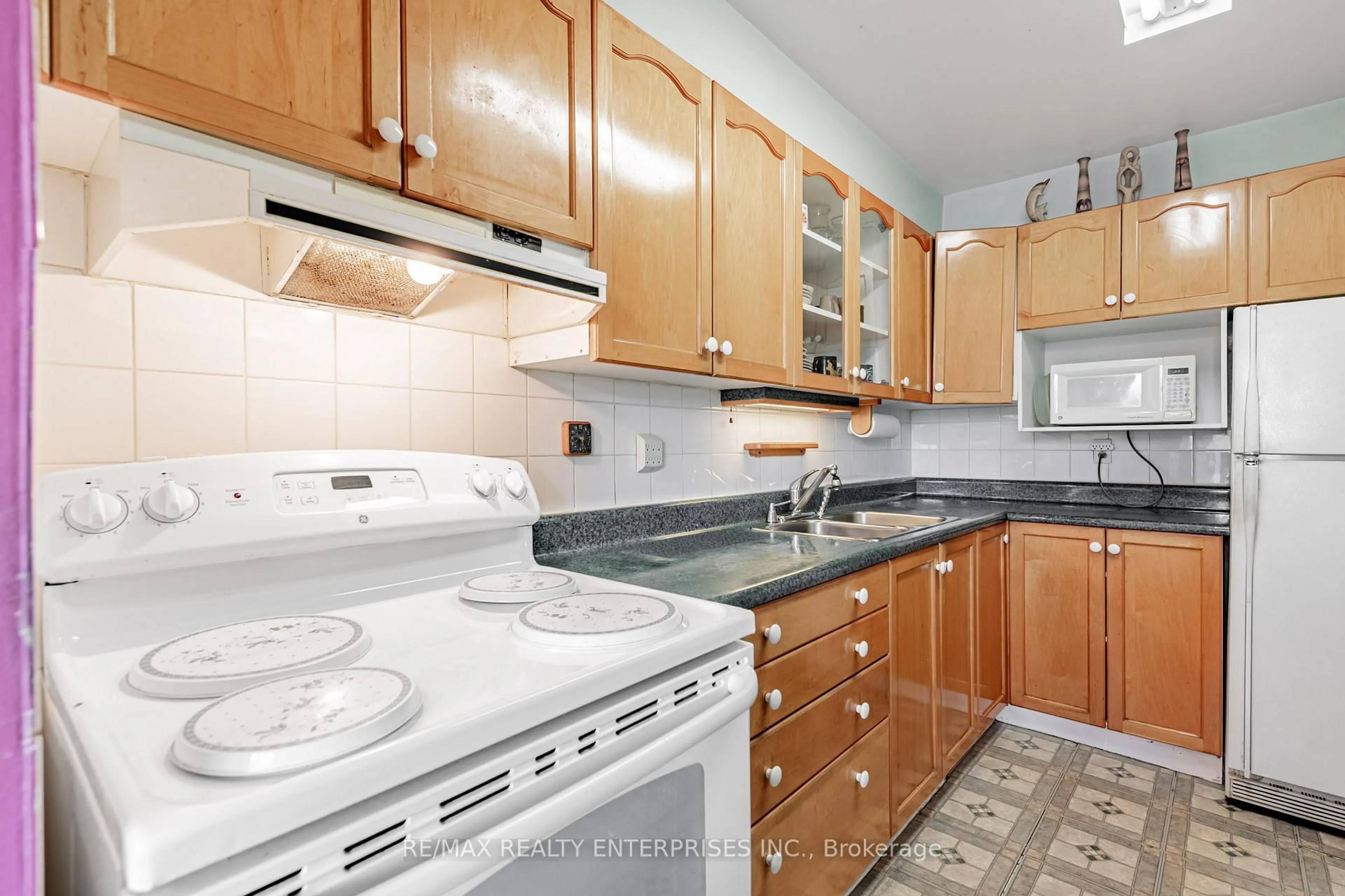 Standard kitchen, unknown for 1 Massey Sq #308, Toronto Ontario M4C 5L4