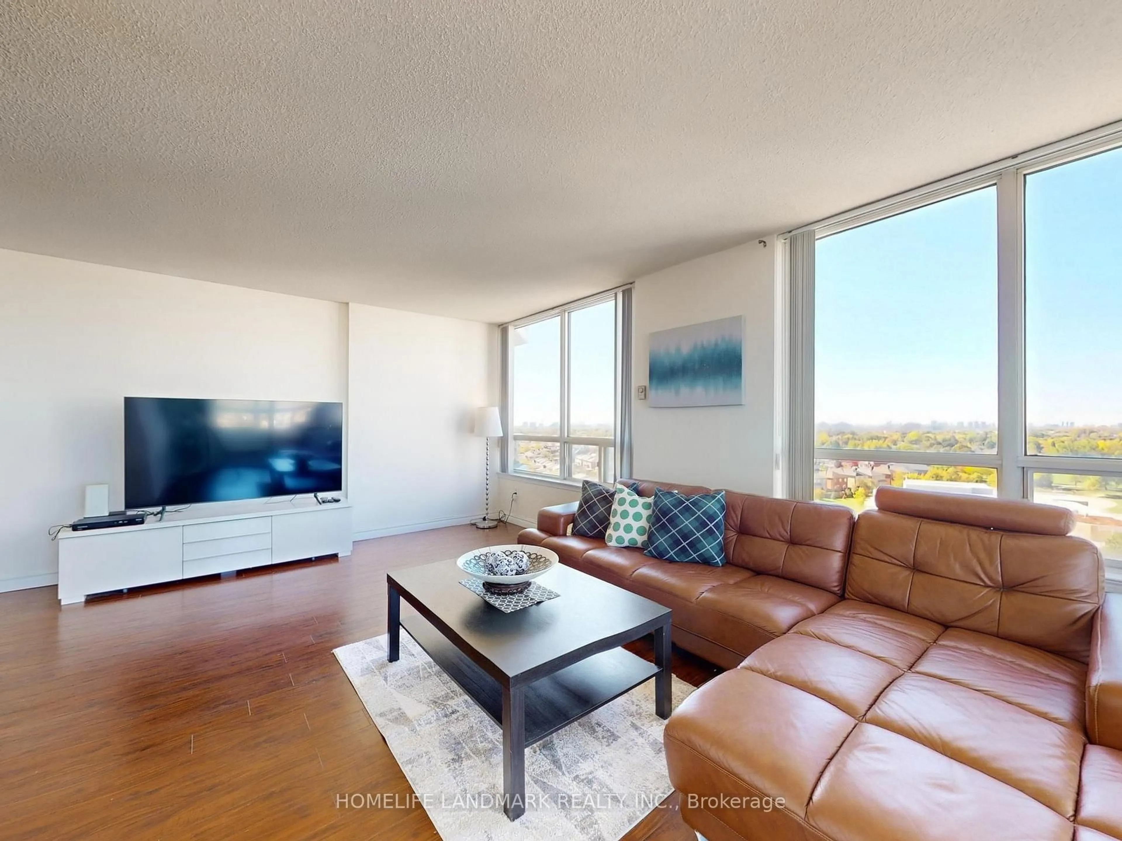 Living room with furniture, wood/laminate floor for 350 Alton Towers Circ #1203, Toronto Ontario M1V 5E3
