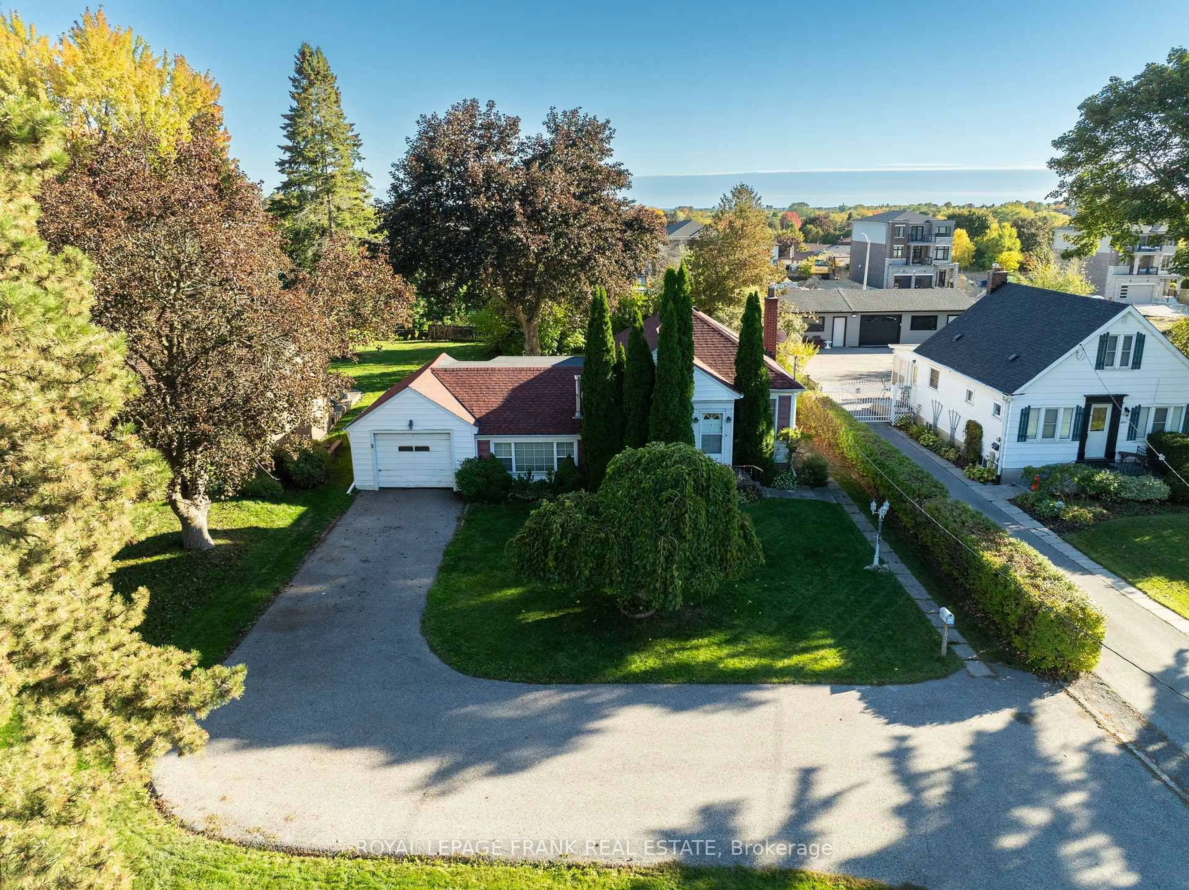 A pic from outside/outdoor area/front of a property/back of a property/a pic from drone, water/lake/river/ocean view for 1033 King St, Oshawa Ontario L1H 1H4