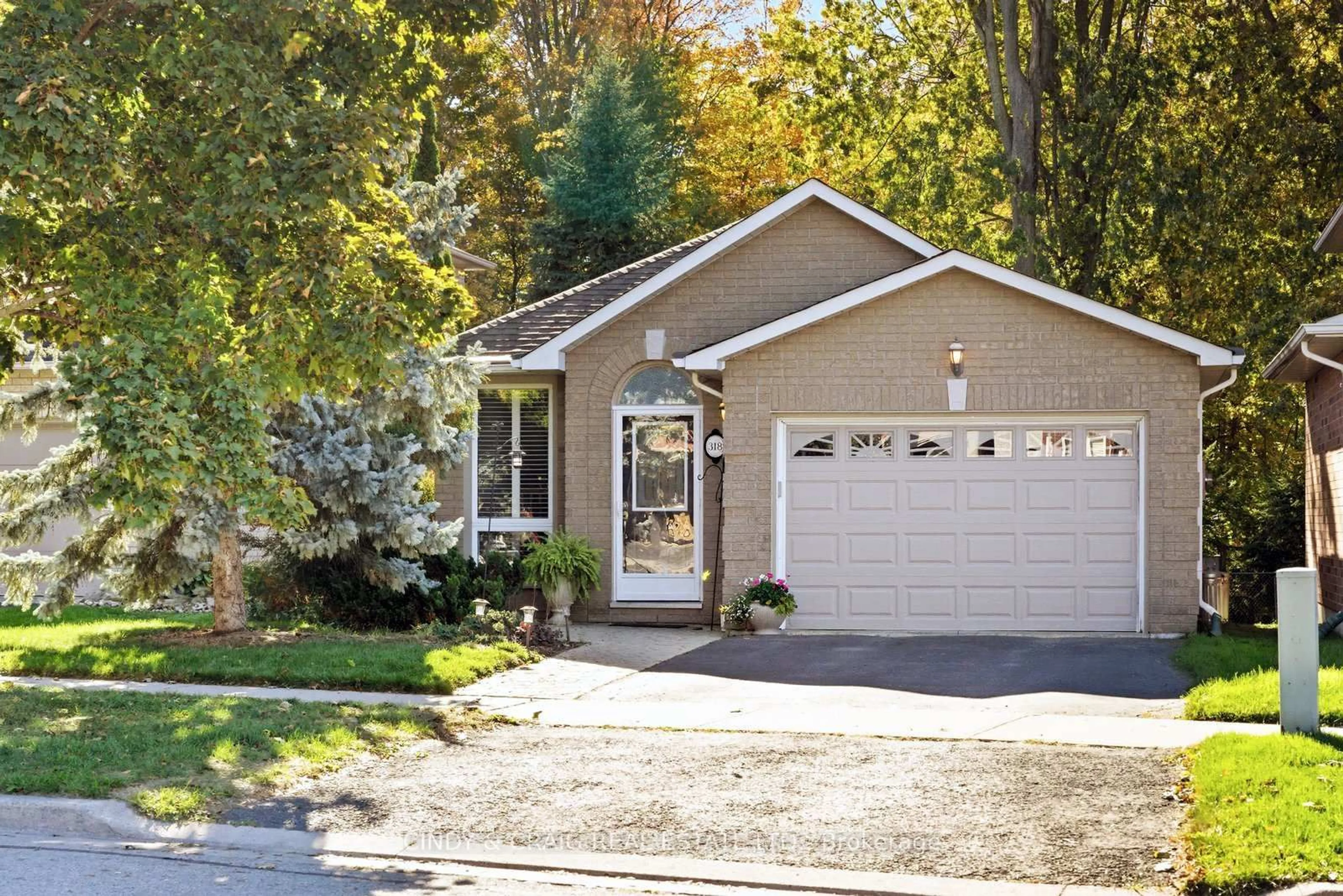 Home with vinyl exterior material, street for 318 Sandringham Dr, Clarington Ontario L1E 3A7