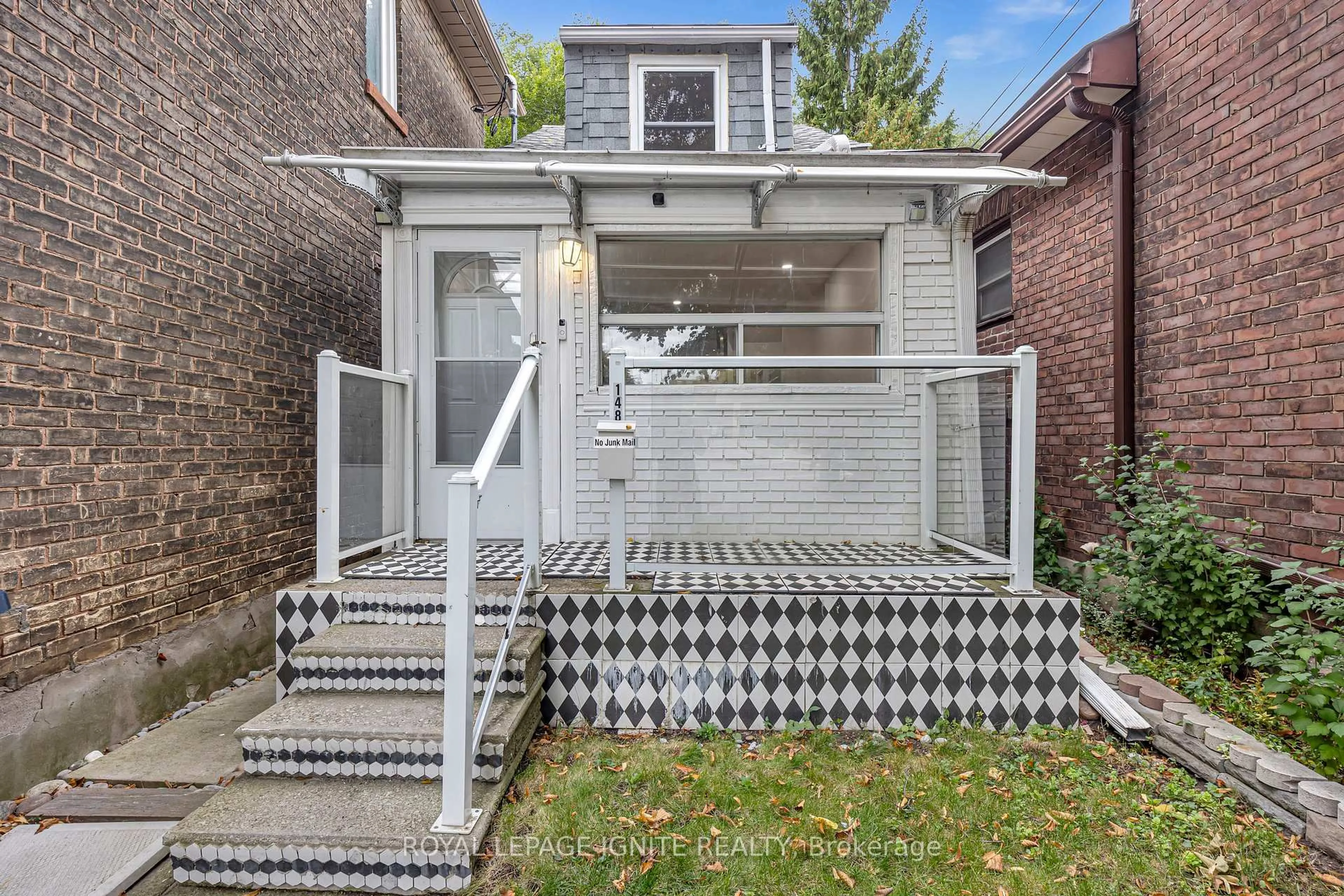 Home with brick exterior material, street for 148 Barrington Ave, Toronto Ontario M4C 4Z2