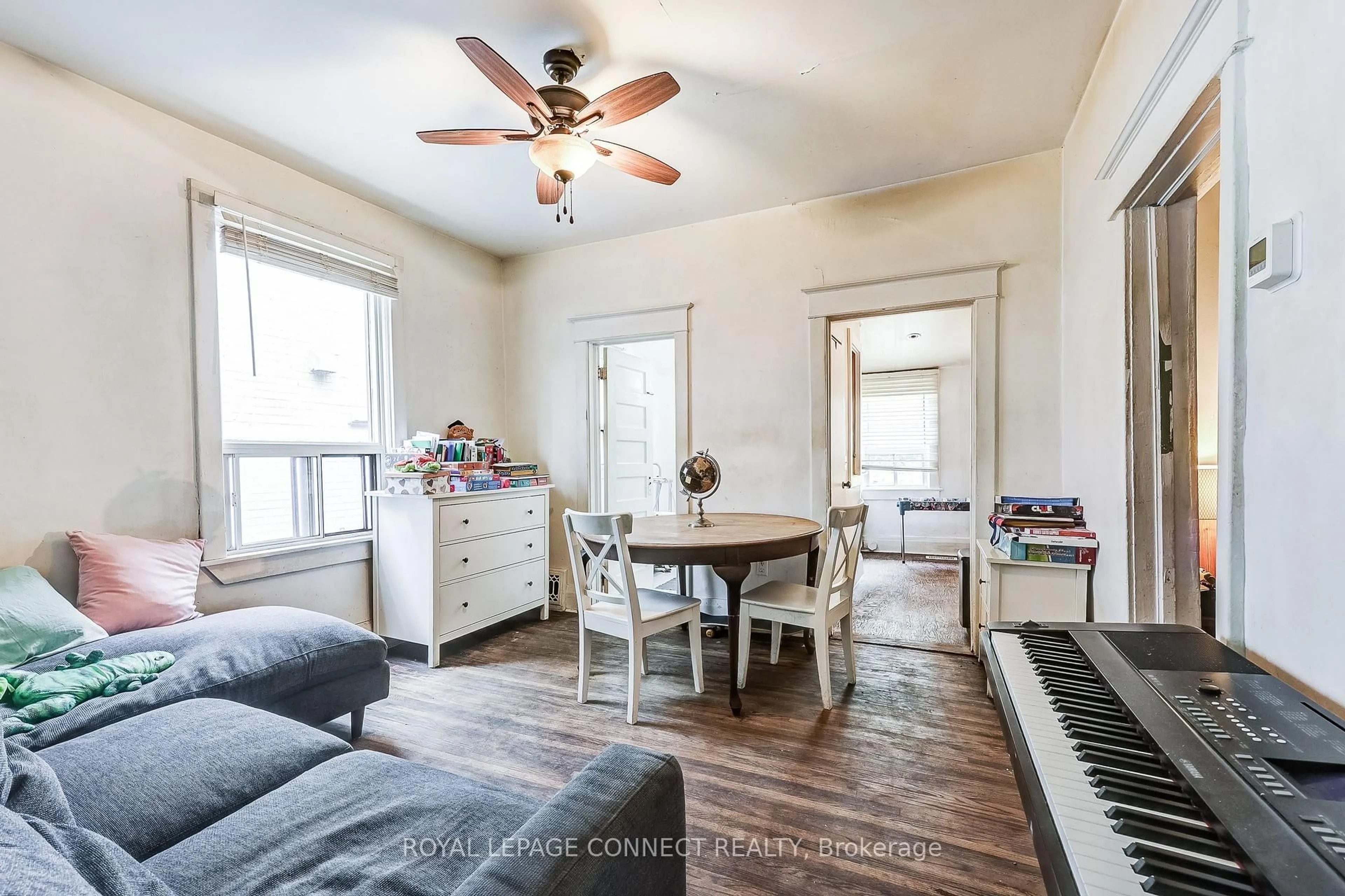 Living room with furniture, wood/laminate floor for 213 Gledhill Ave, Toronto Ontario M4C 5K9