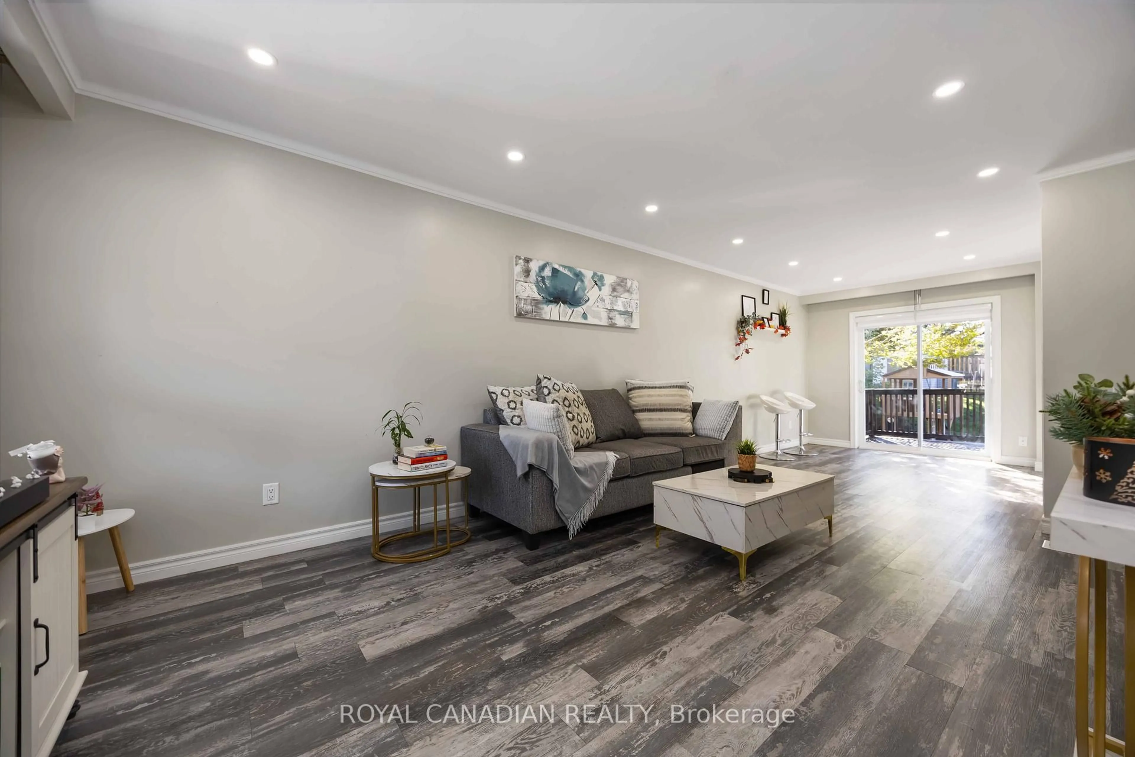 Living room with furniture, wood/laminate floor for 1057 King St, Oshawa Ontario L1H 1H6