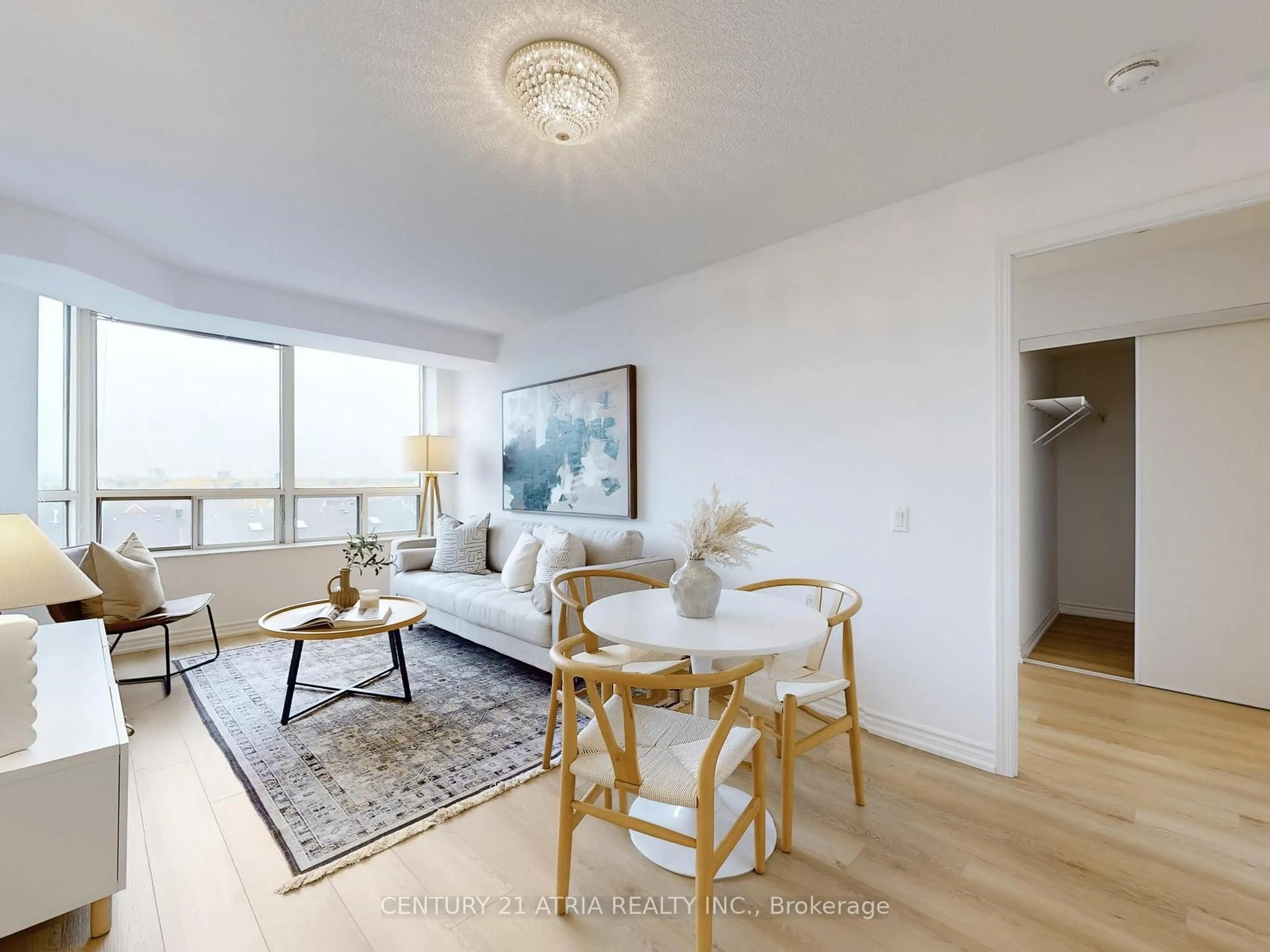 Living room with furniture, wood/laminate floor for 3088 Kennedy Rd #712, Toronto Ontario M1V 5M4