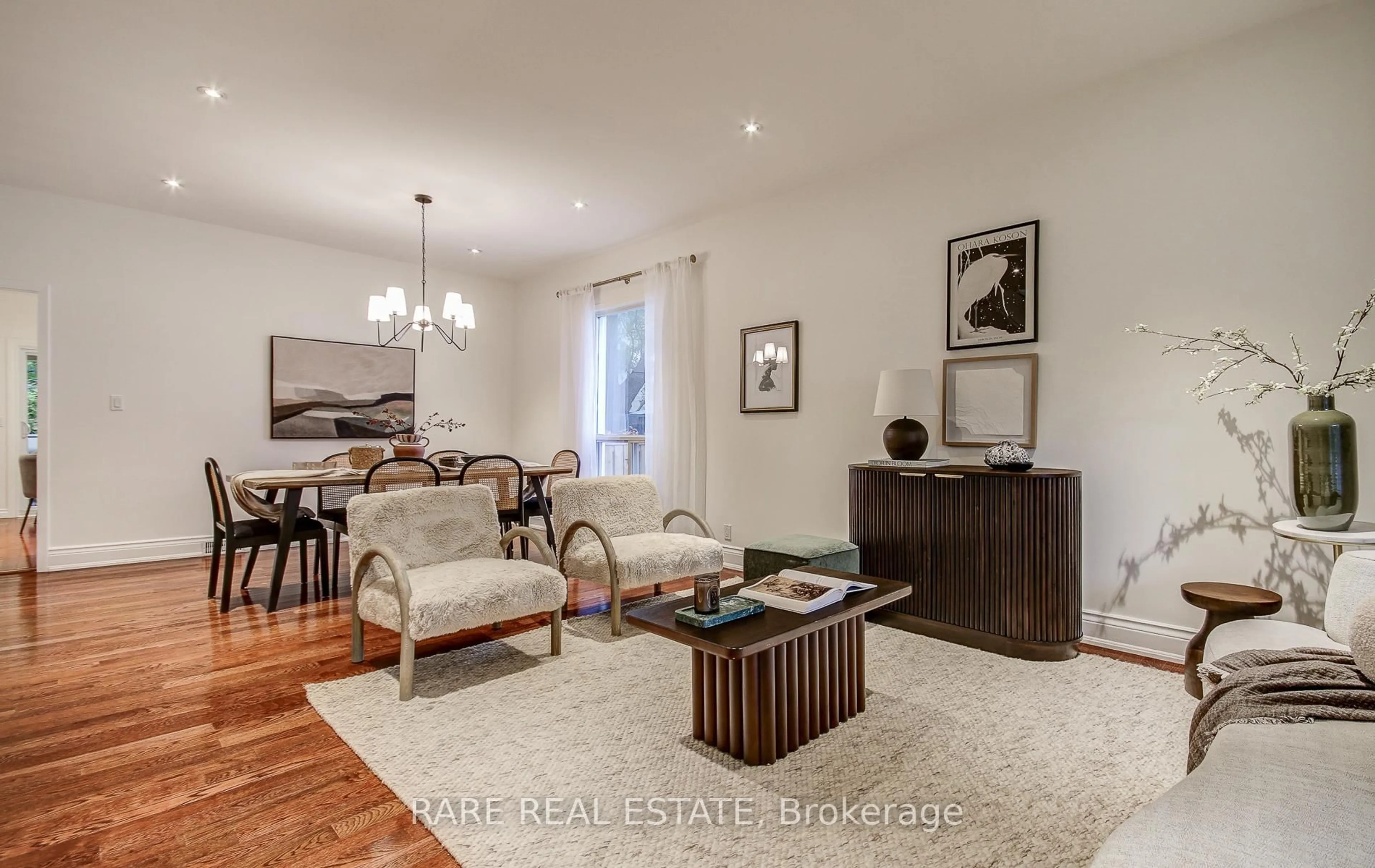 Living room with furniture, wood/laminate floor for 965 Logan Ave, Toronto Ontario M4K 3E6