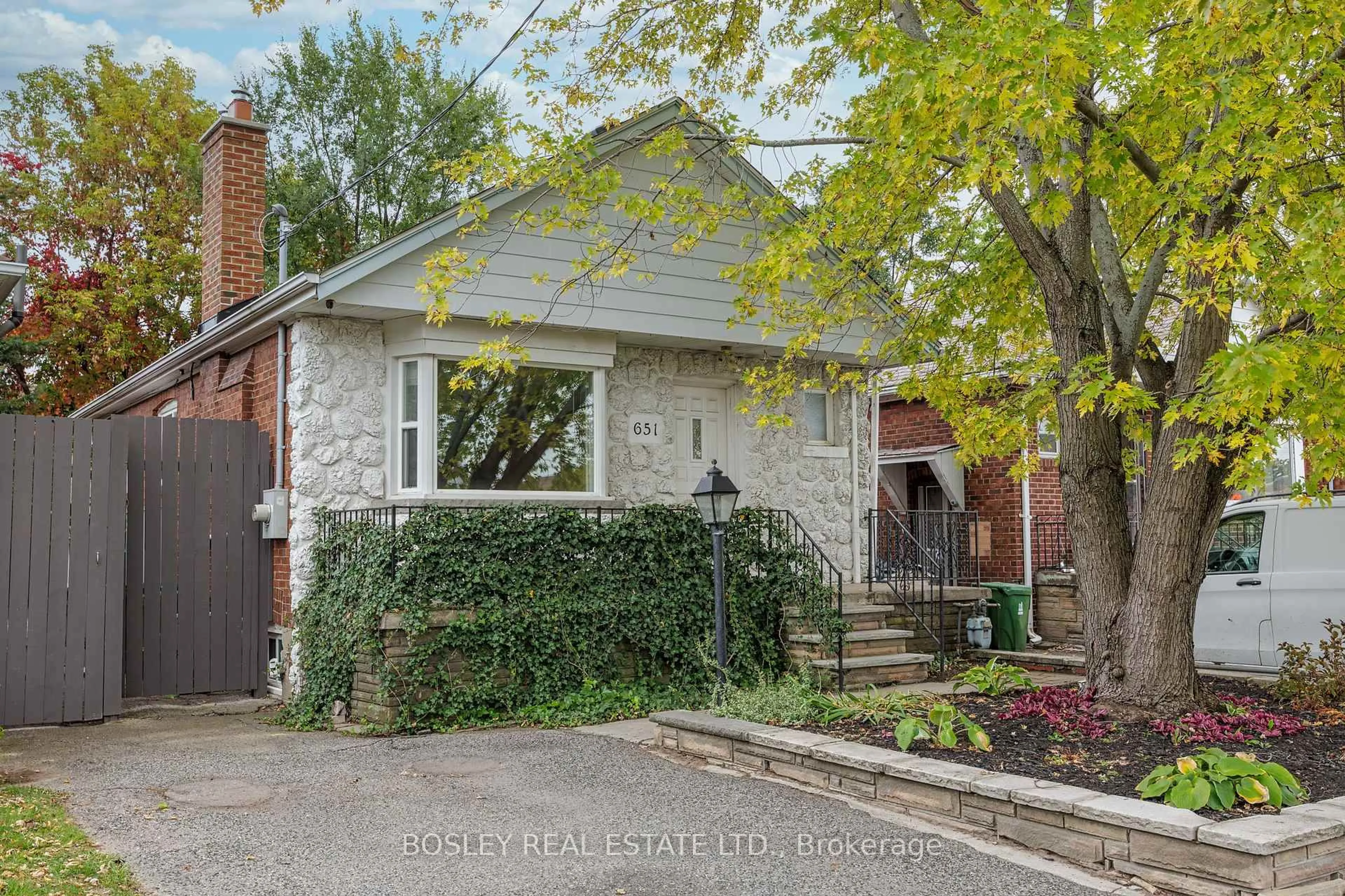 Home with brick exterior material, street for 651 Cosburn Ave, Toronto Ontario M4C 2V1