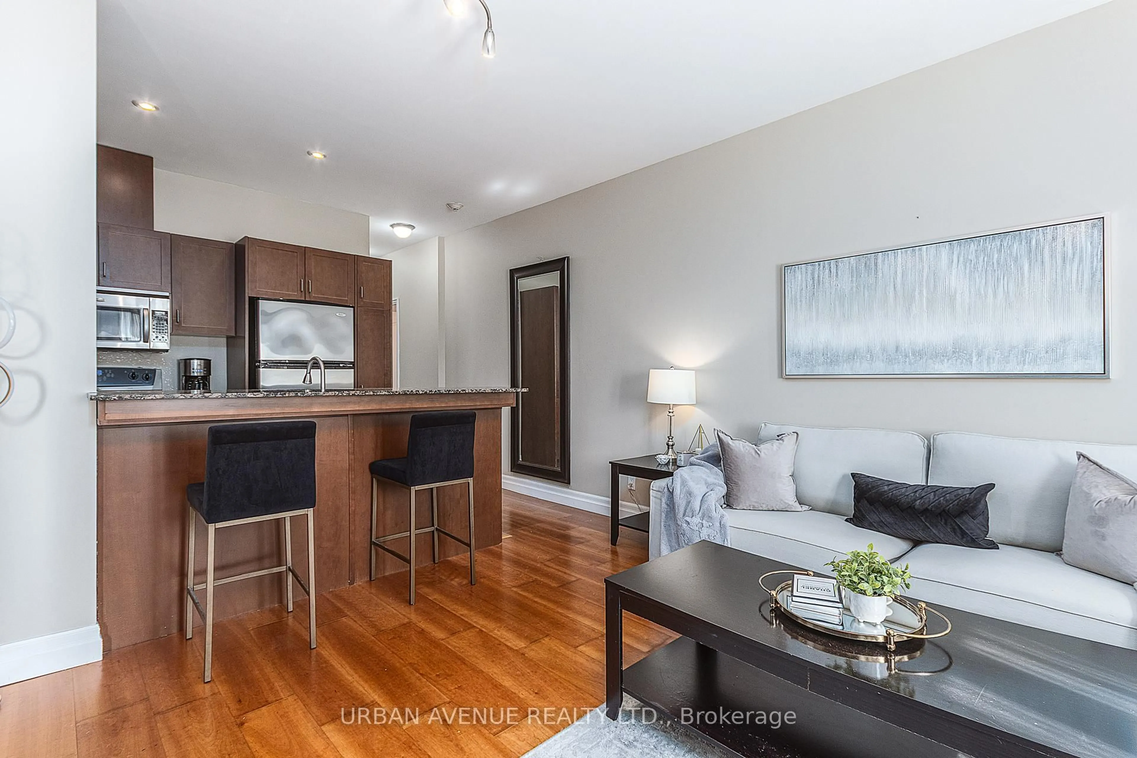 Open concept kitchen, wood/laminate floor for 44 Bond St #707, Oshawa Ontario L1G 6R2
