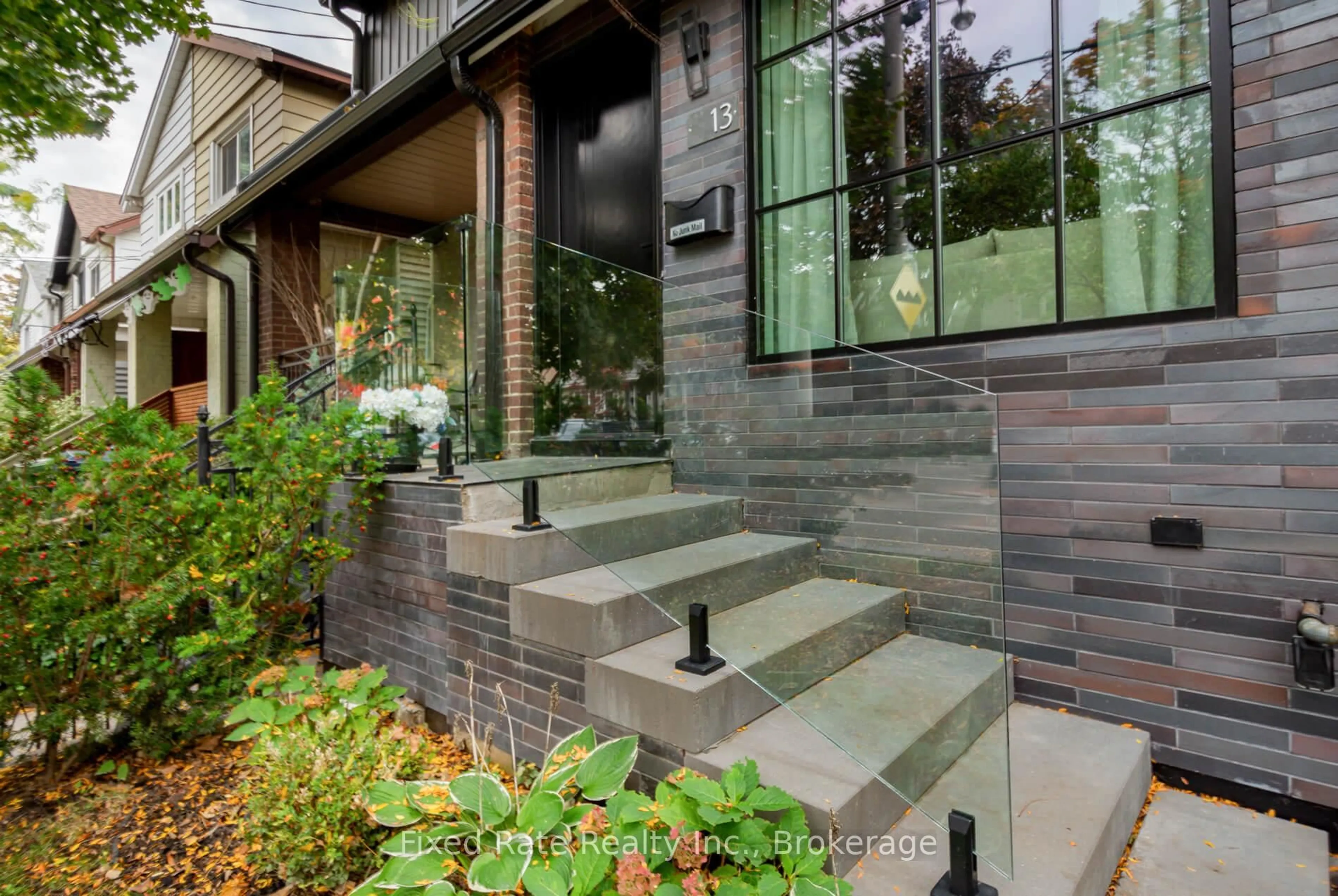 Home with brick exterior material, street for 13 Larchmount Ave, Toronto Ontario M4M 2Y6