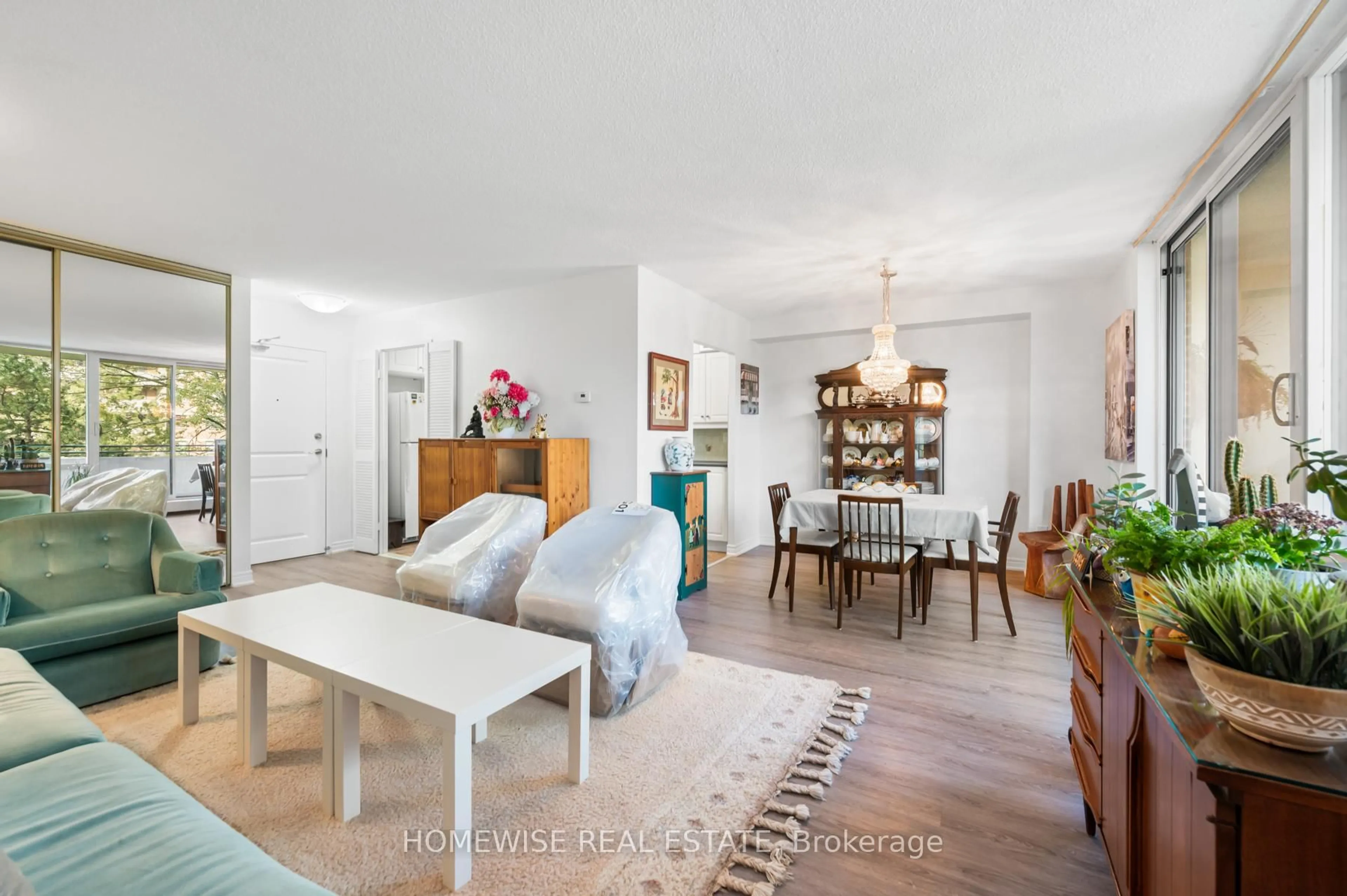 Living room with furniture, wood/laminate floor for 101 Prudential Dr #314, Toronto Ontario M1P 4S5