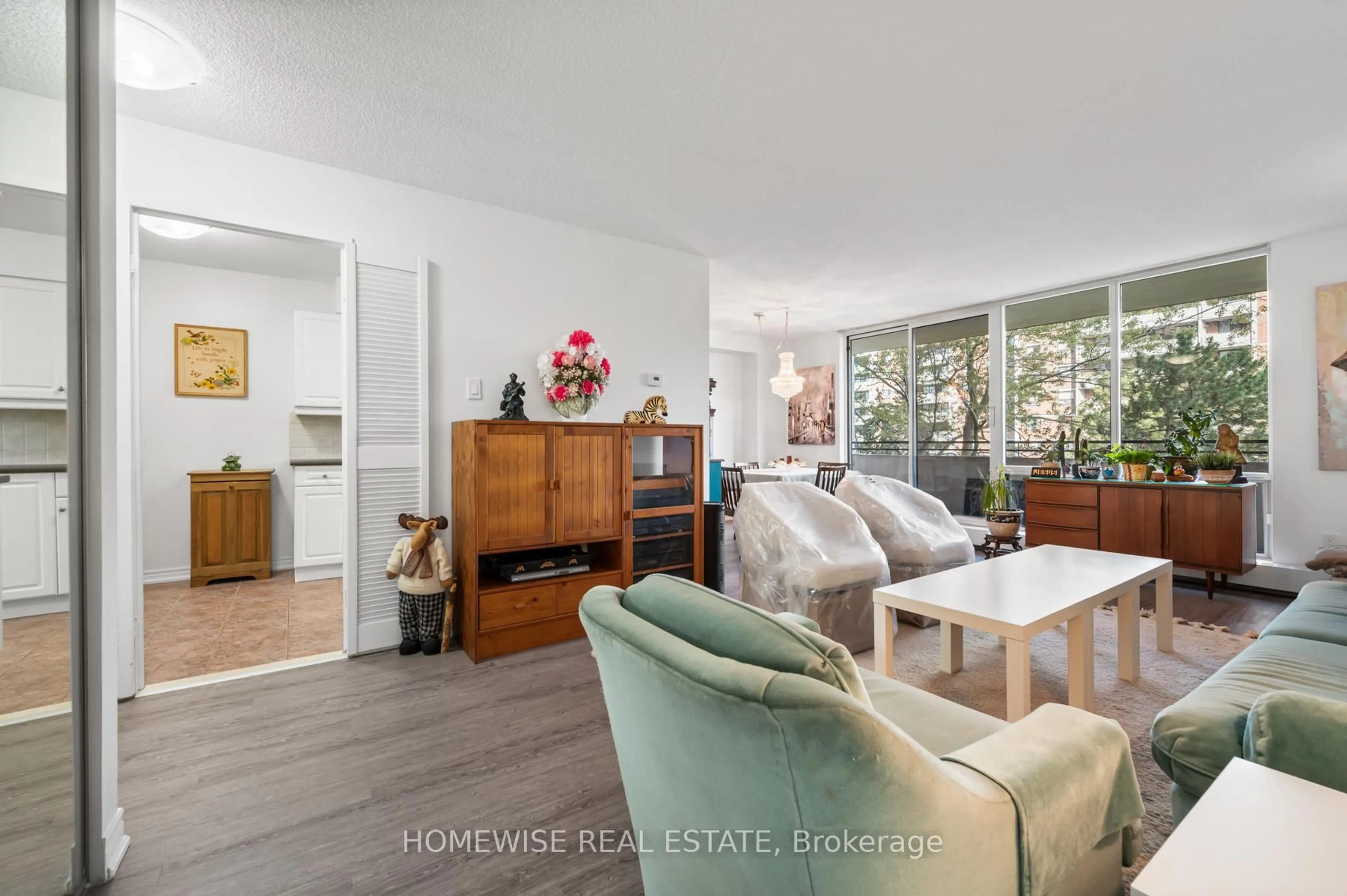 Living room with furniture, wood/laminate floor for 101 Prudential Dr #314, Toronto Ontario M1P 4S5