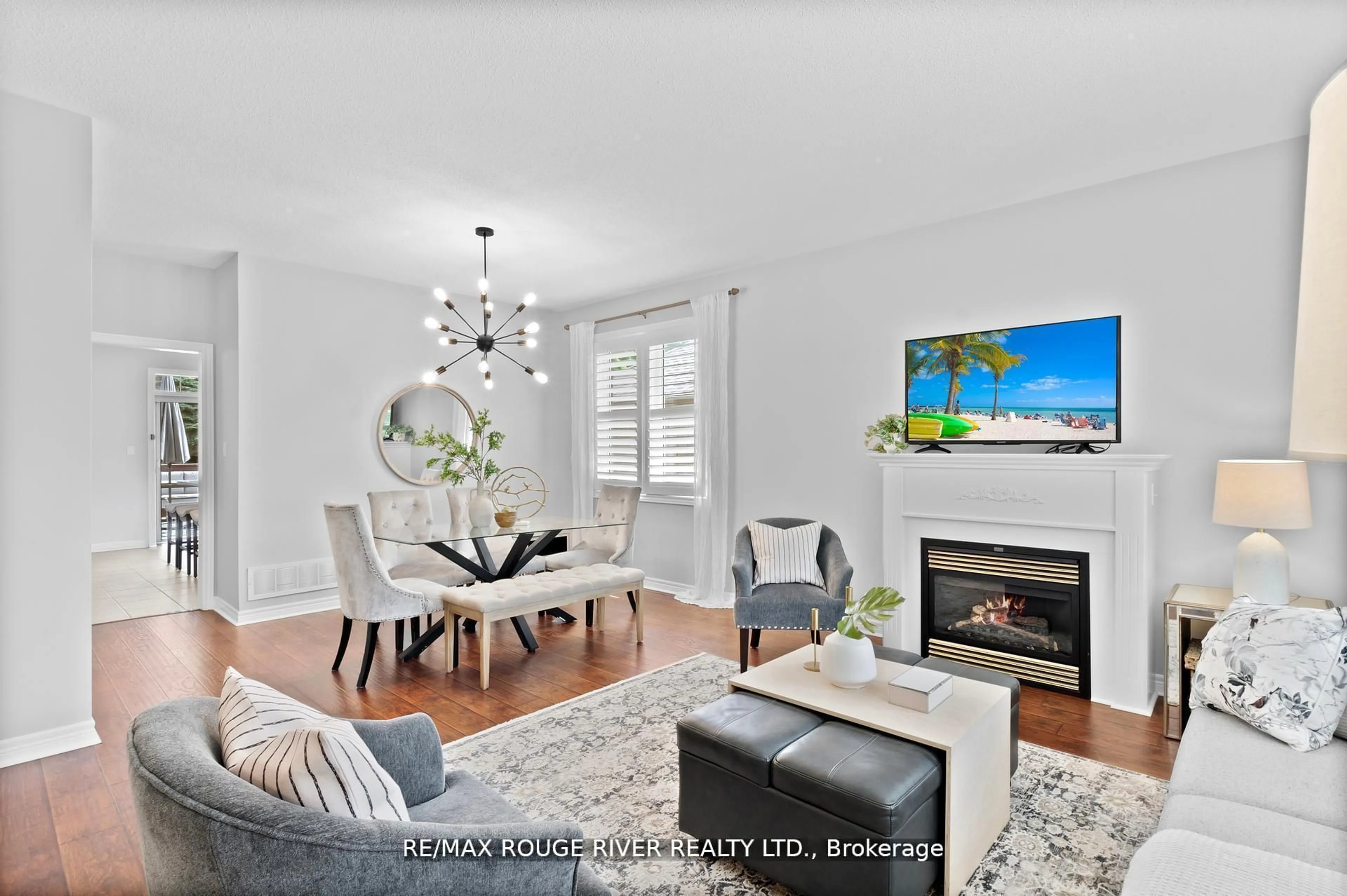 Living room with furniture, wood/laminate floor for 11 Maple Edge Lane, Whitby Ontario L1R 2M9