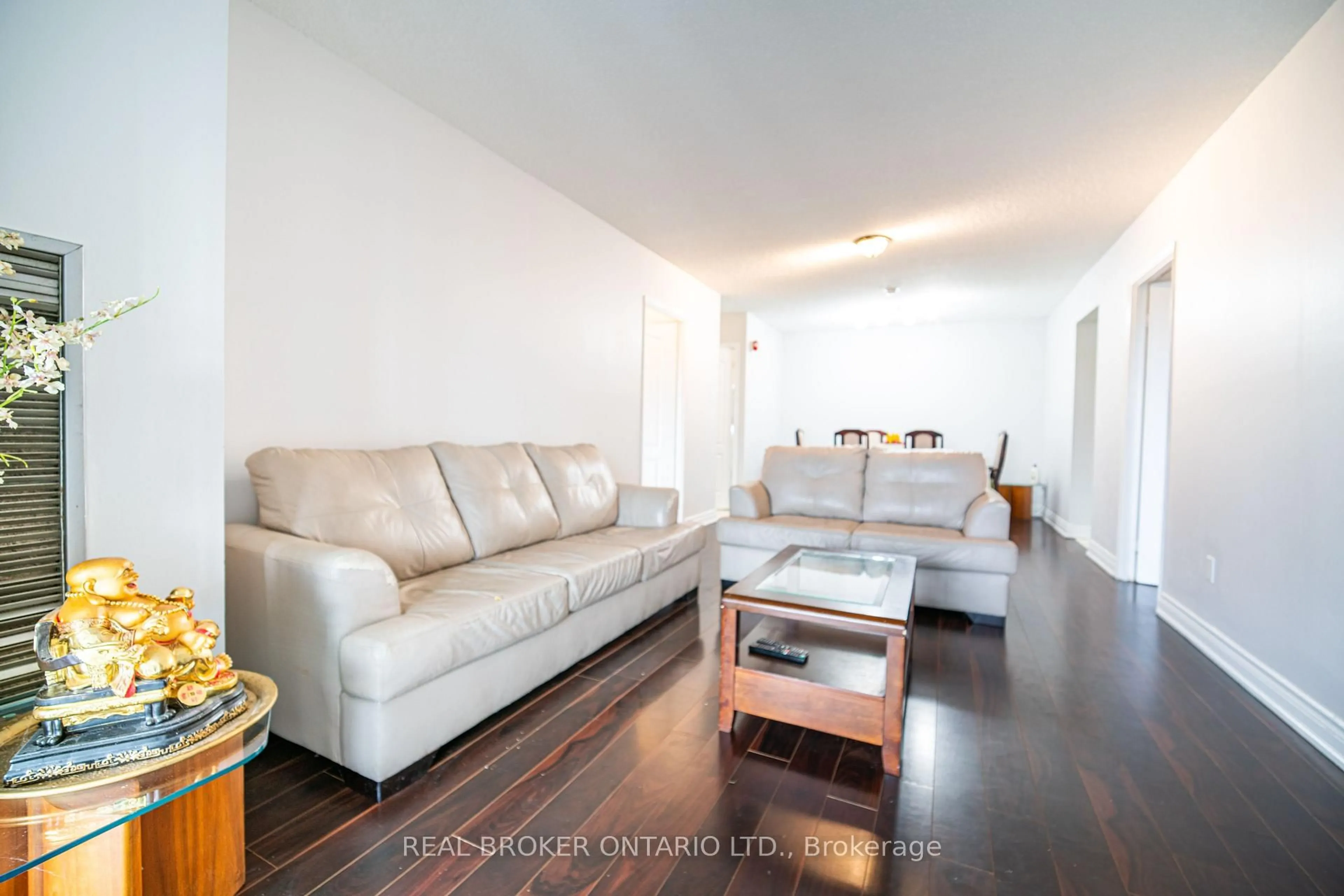 Living room with furniture, wood/laminate floor for 39 Kimbercroft Crt #414, Toronto Ontario M1S 5B5