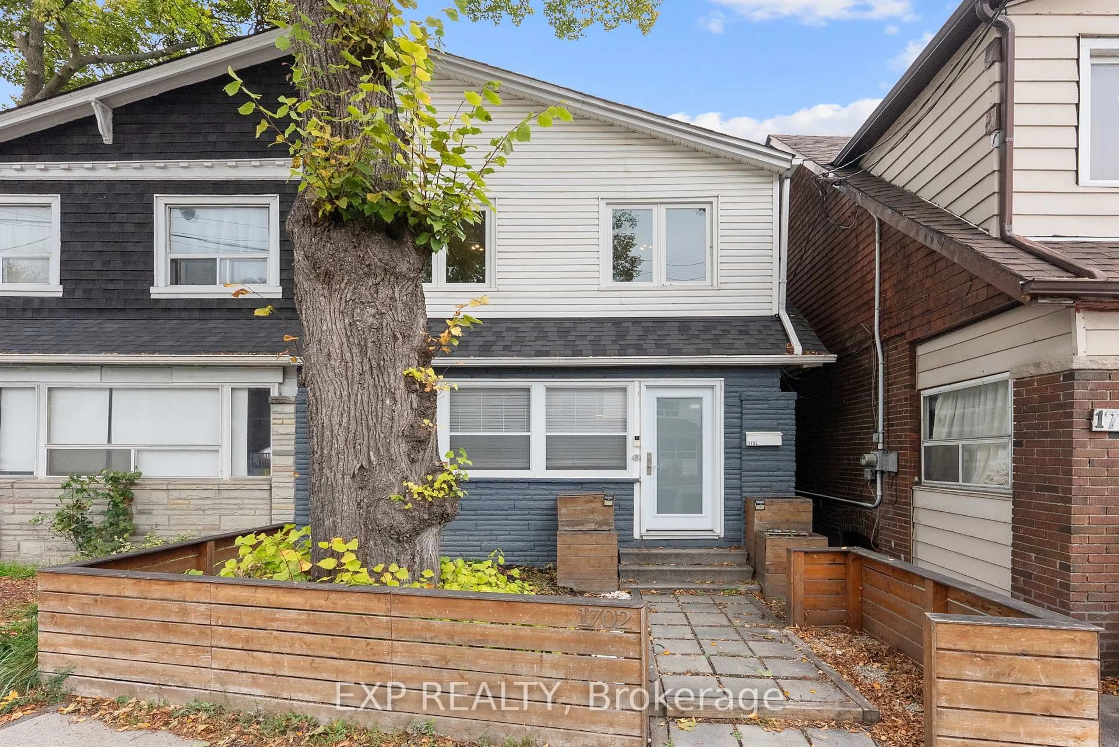 Home with brick exterior material, street for 1702 Dundas St, Toronto Ontario M4L 1L6