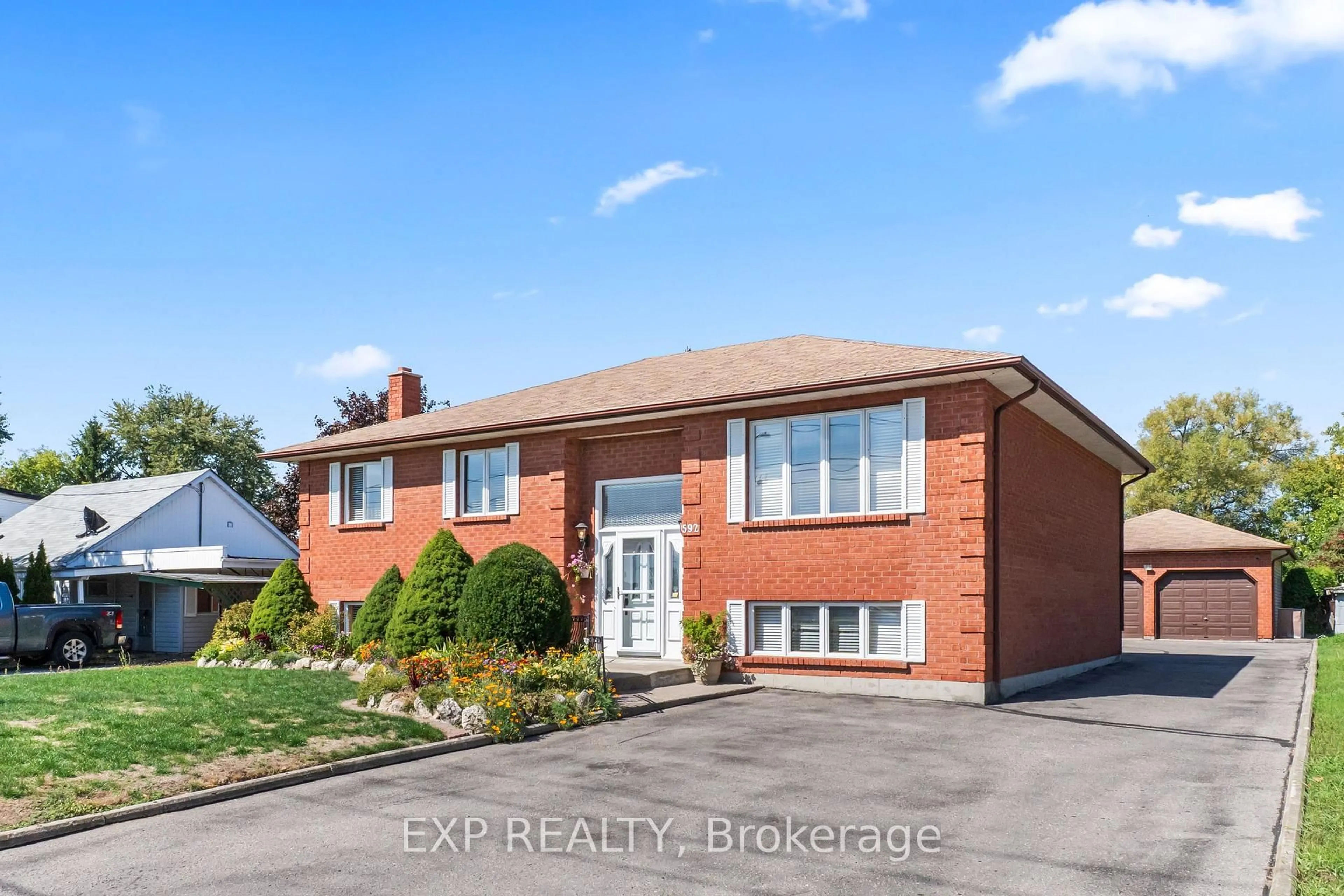 Home with brick exterior material, street for 592 Taunton Rd, Oshawa Ontario L1H 7K4