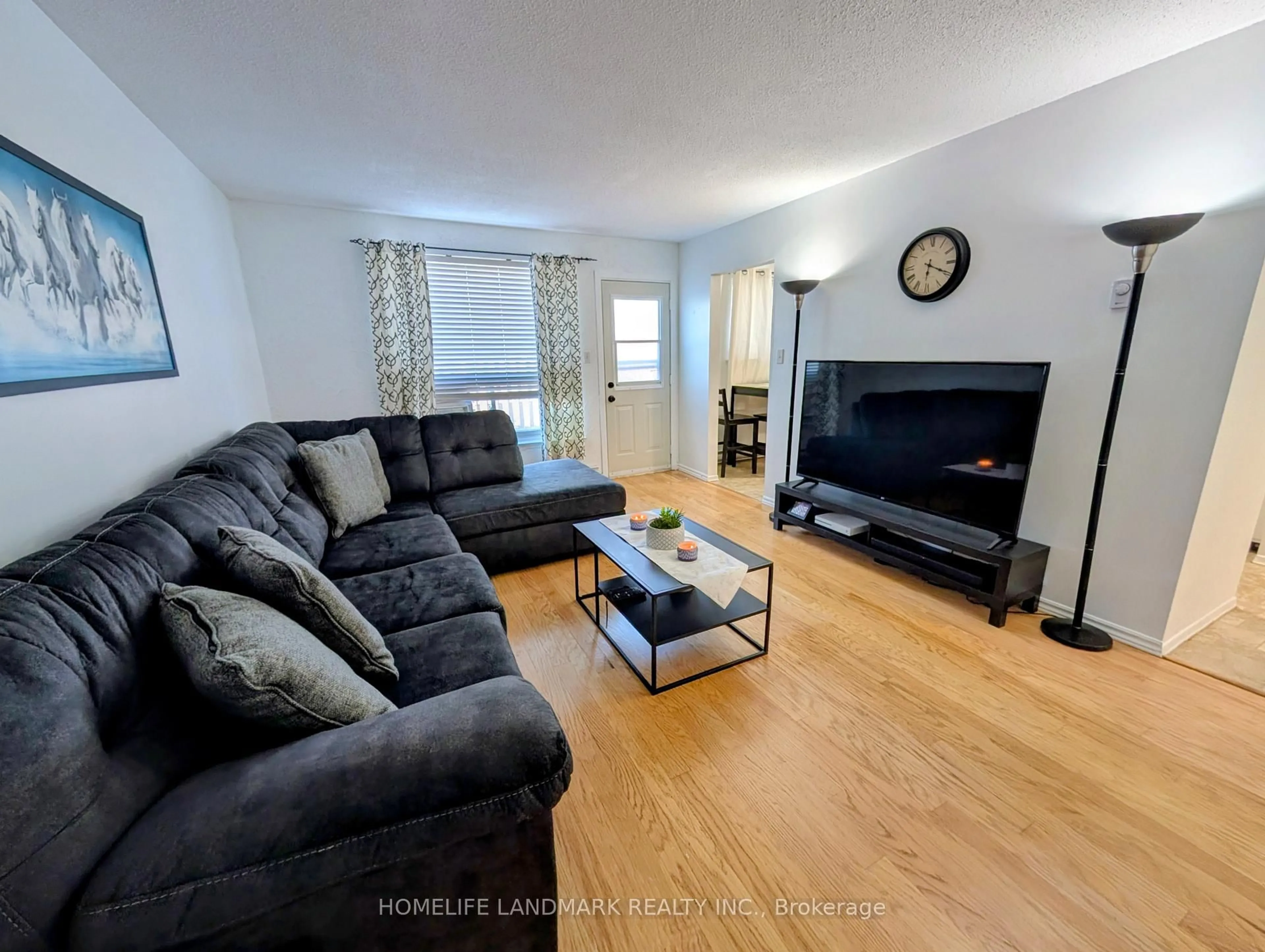 Living room with furniture, unknown for 120 Nonquon Rd #15, Oshawa Ontario L1G 7E6