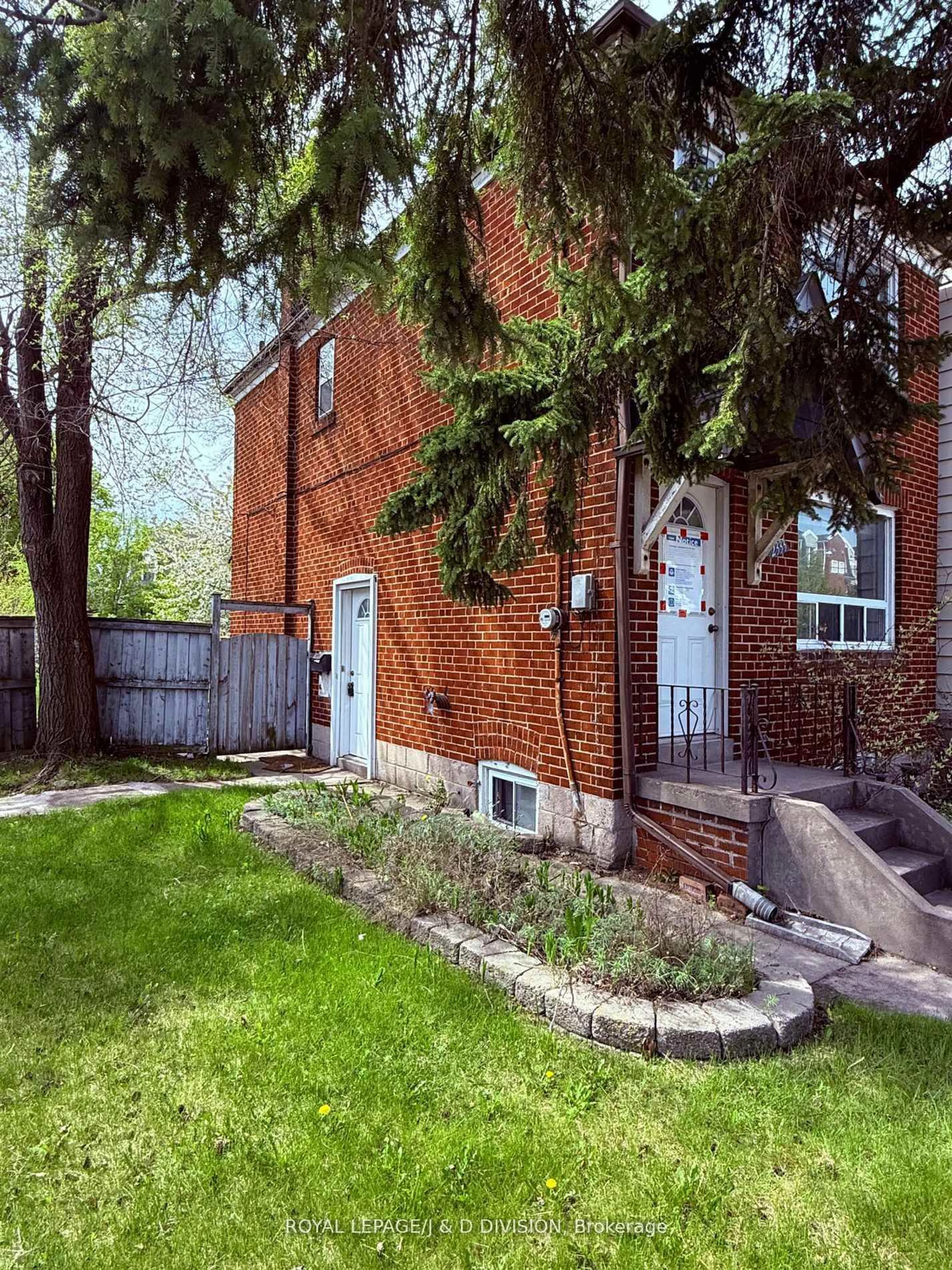 Home with brick exterior material, street for 2333 Gerrard St, Toronto Ontario M4E 2E5