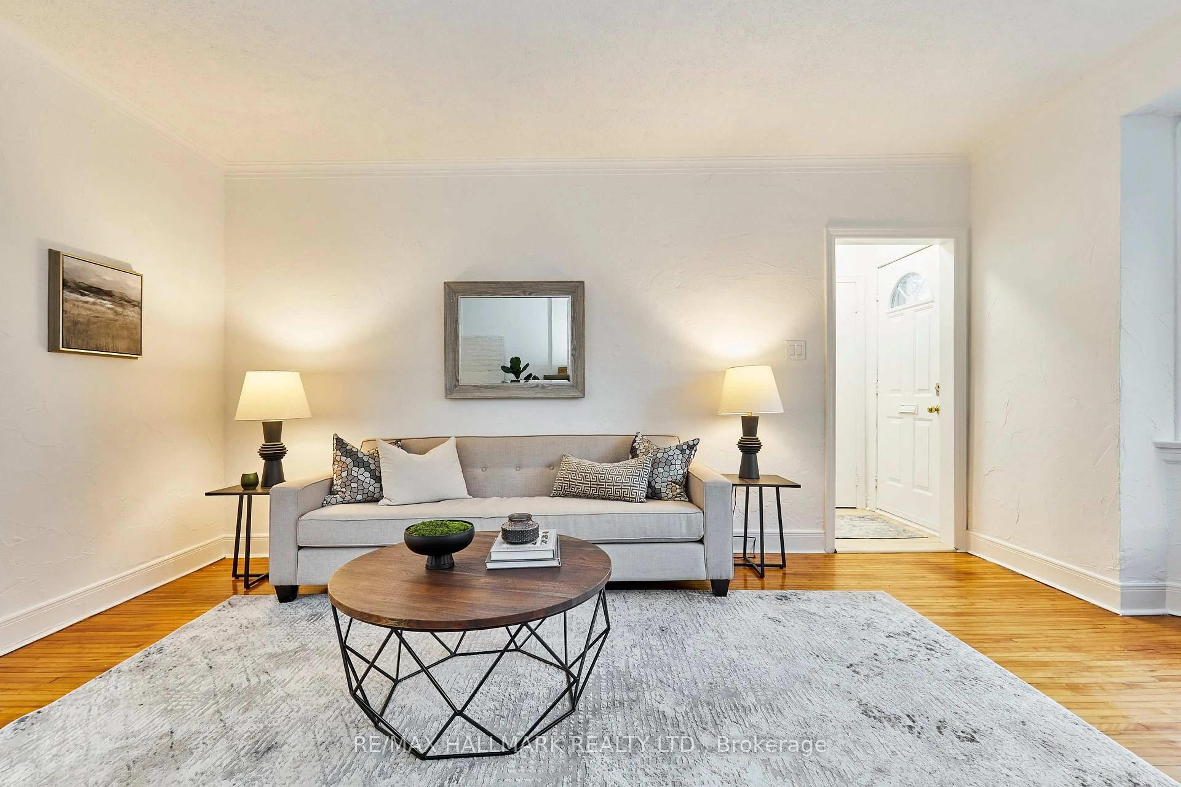 Living room with furniture, wood/laminate floor for 1254 Kingston Rd, Toronto Ontario M1N 1P3