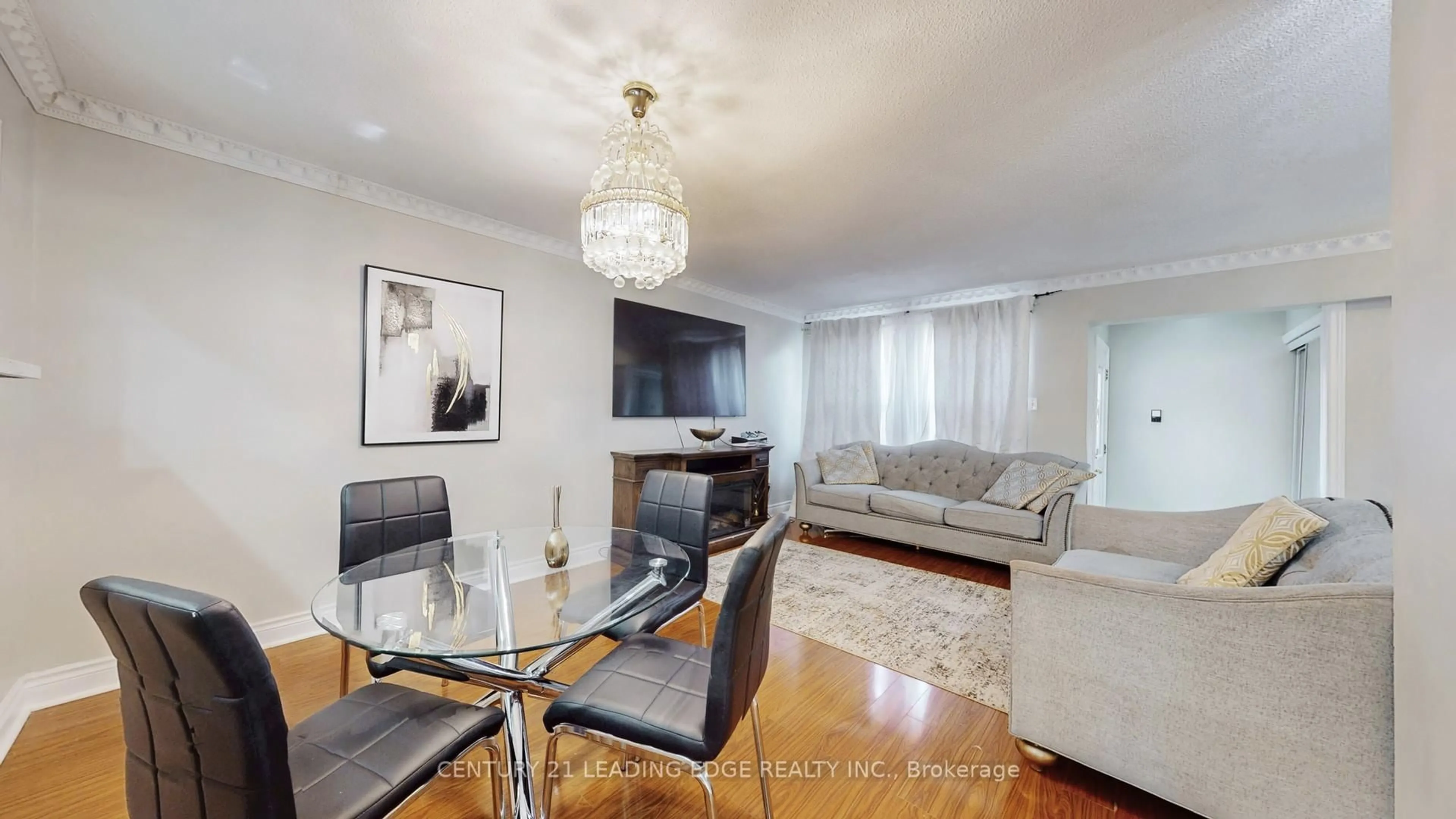 Living room with furniture, wood/laminate floor for 101 Red River Cres, Toronto Ontario M1B 1Z5