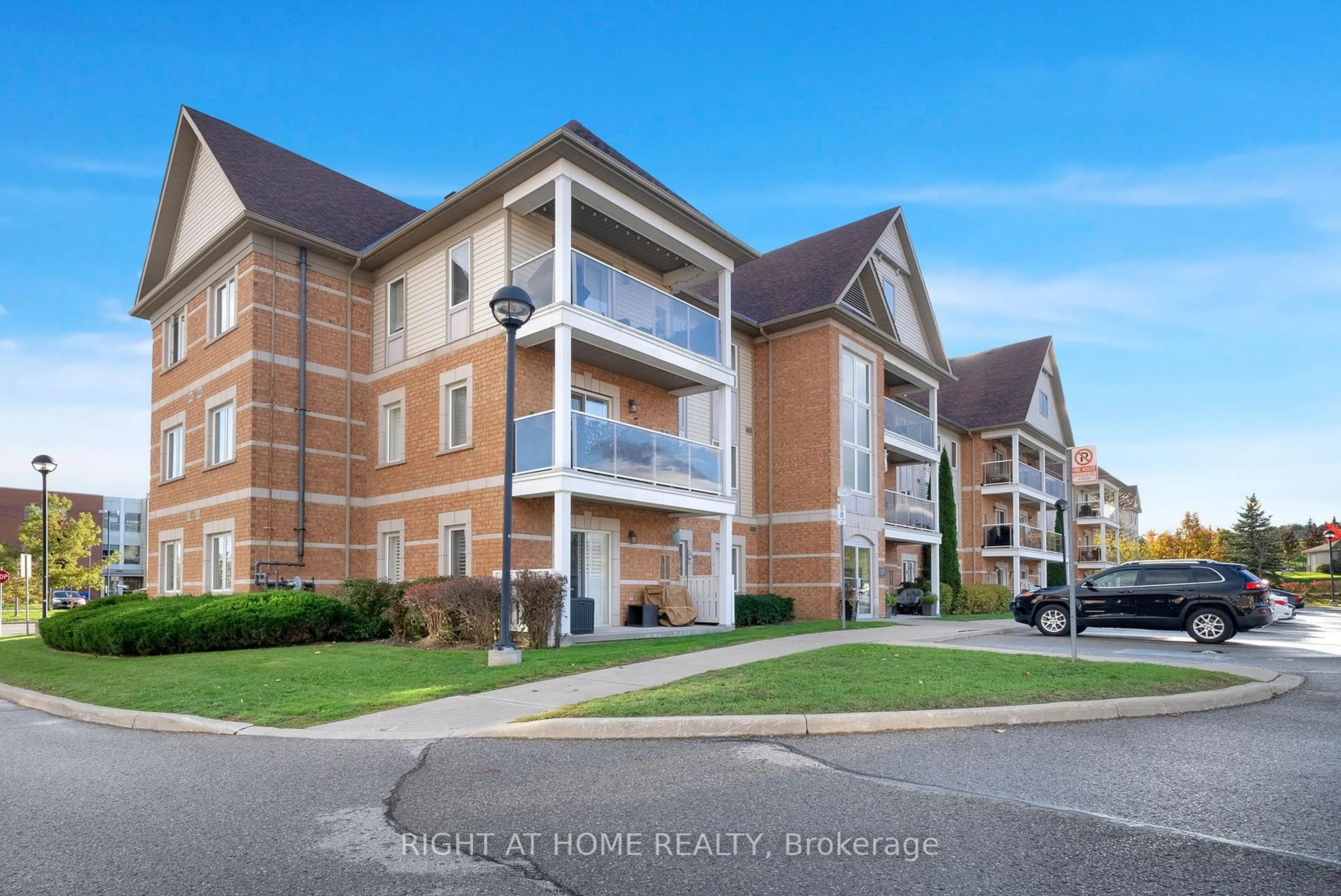 A pic from outside/outdoor area/front of a property/back of a property/a pic from drone, unknown for 132 Aspen Springs Dr #205, Clarington Ontario L1C 0H1