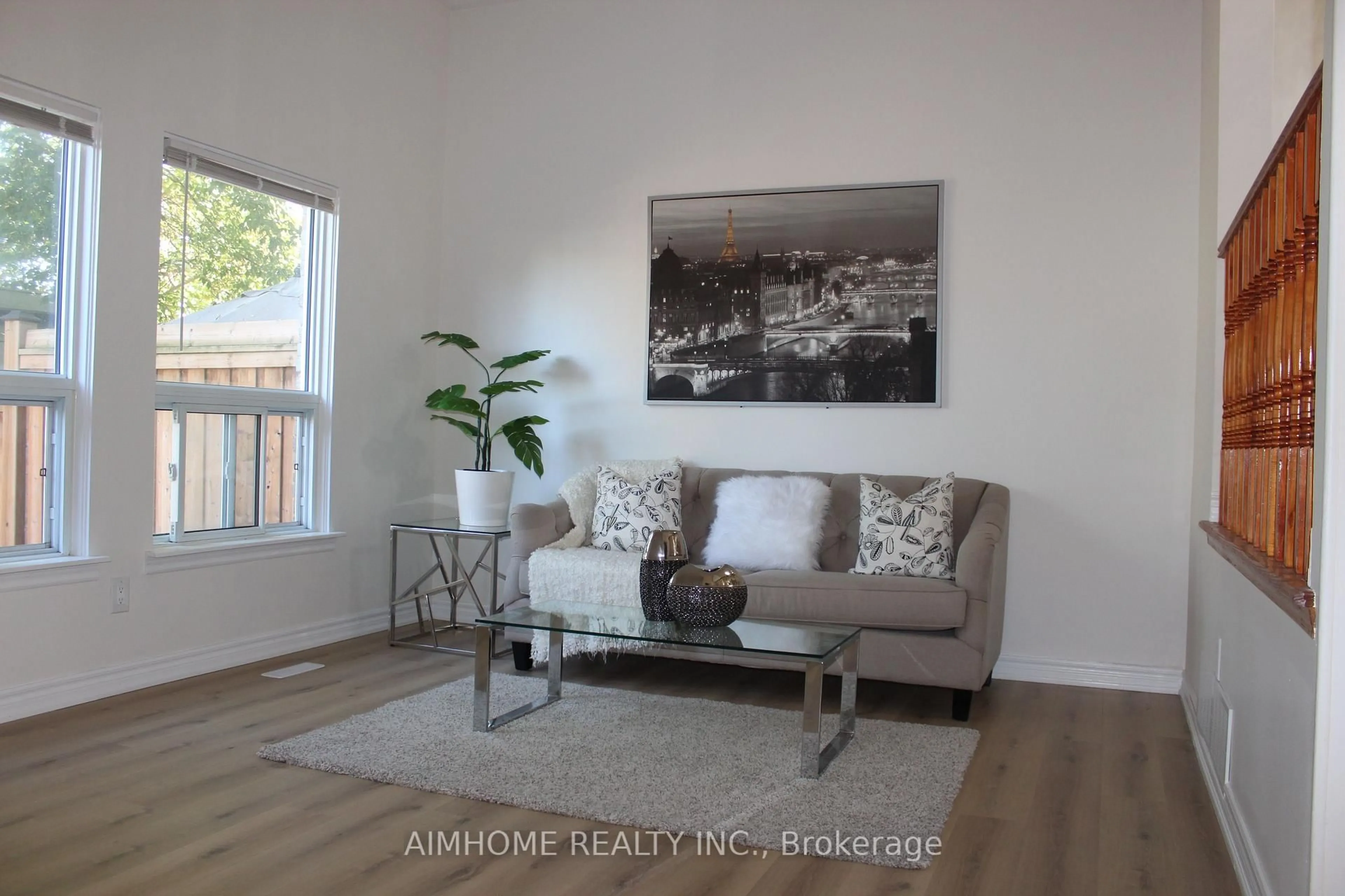 Living room with furniture, wood/laminate floor for 2311 Bridletowne Circ, Toronto Ontario M1W 2L3