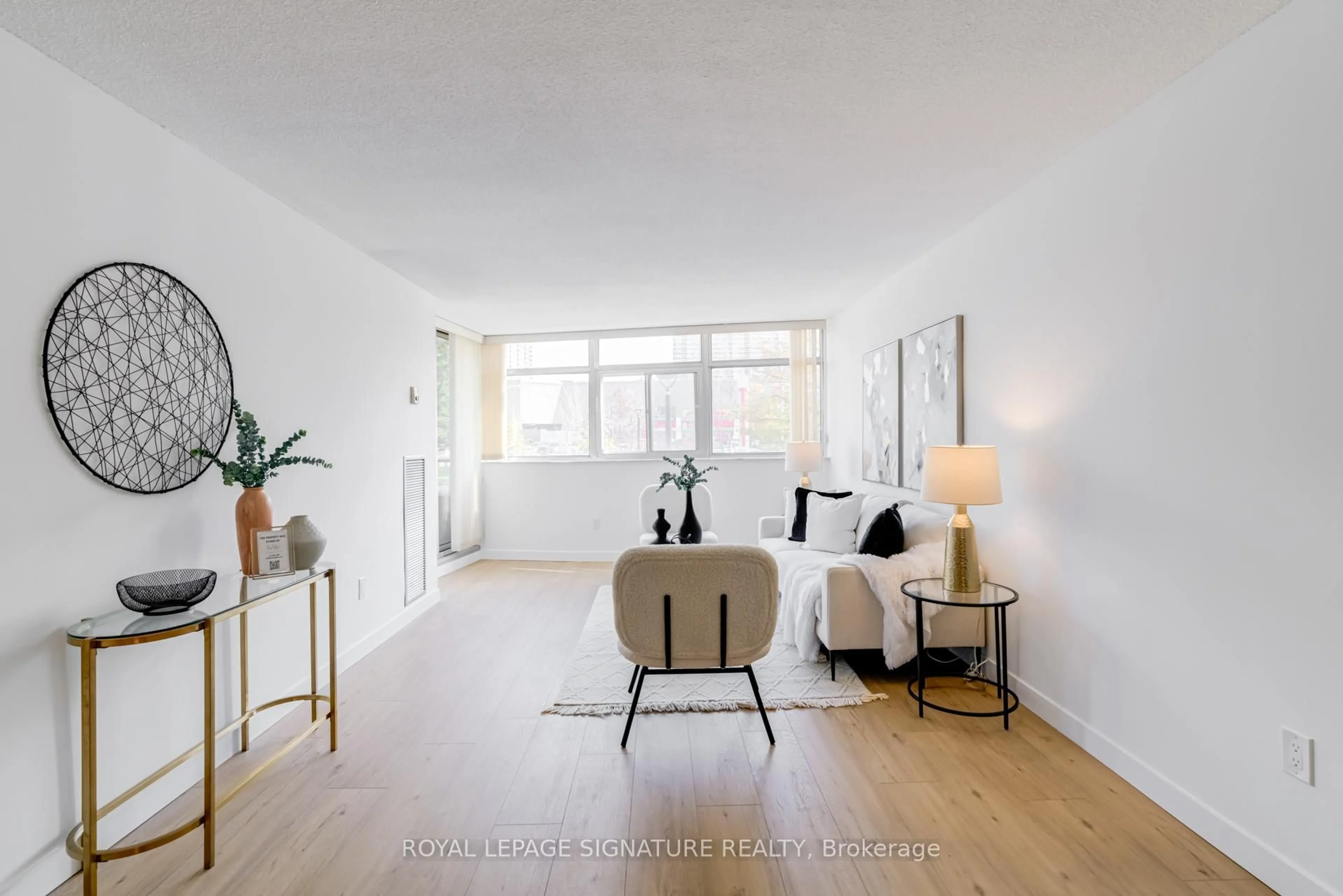 Living room with furniture, unknown for 3151 Bridletowne Circ #203, Toronto Ontario M1W 2T1