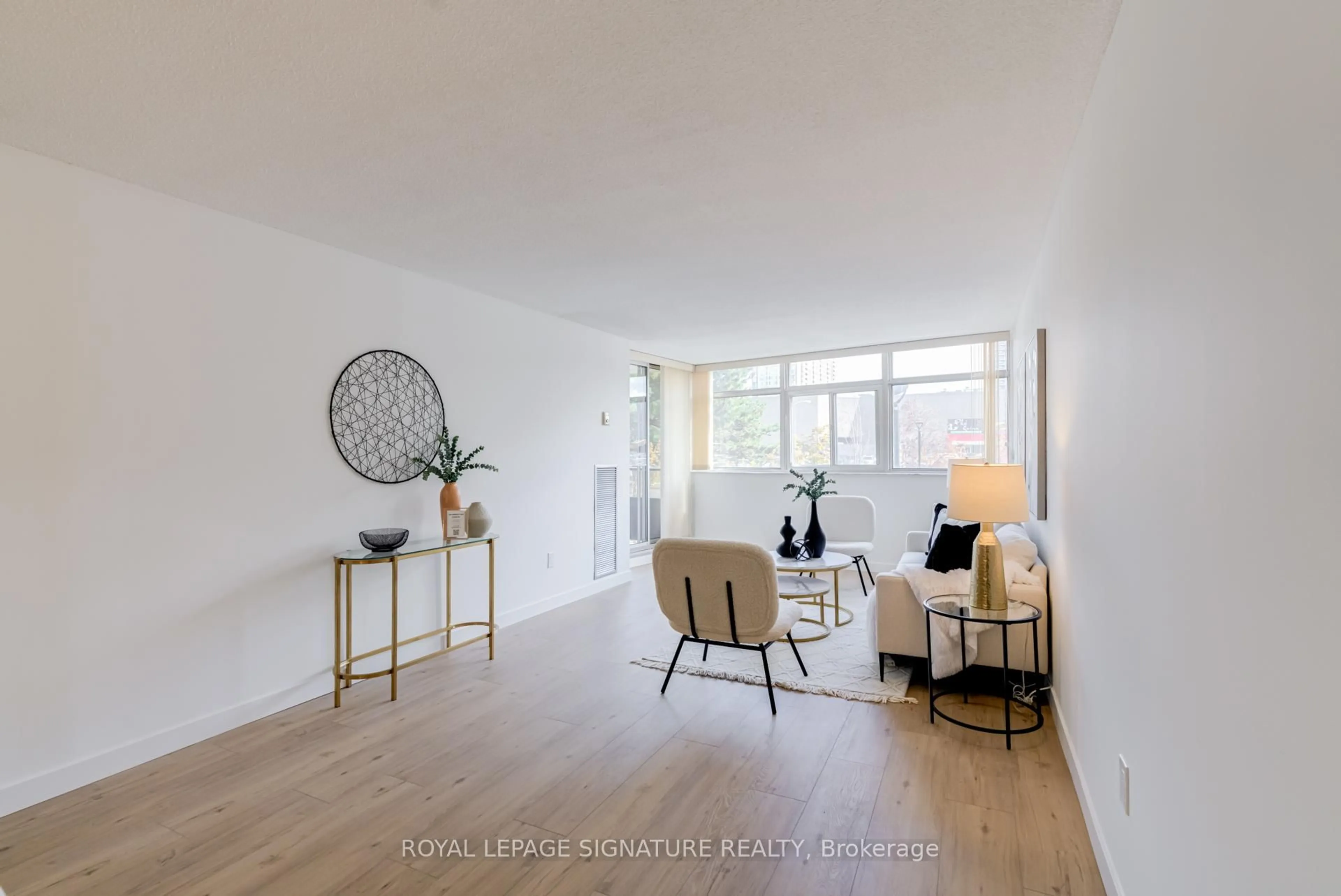 Living room with furniture, unknown for 3151 Bridletowne Circ #203, Toronto Ontario M1W 2T1