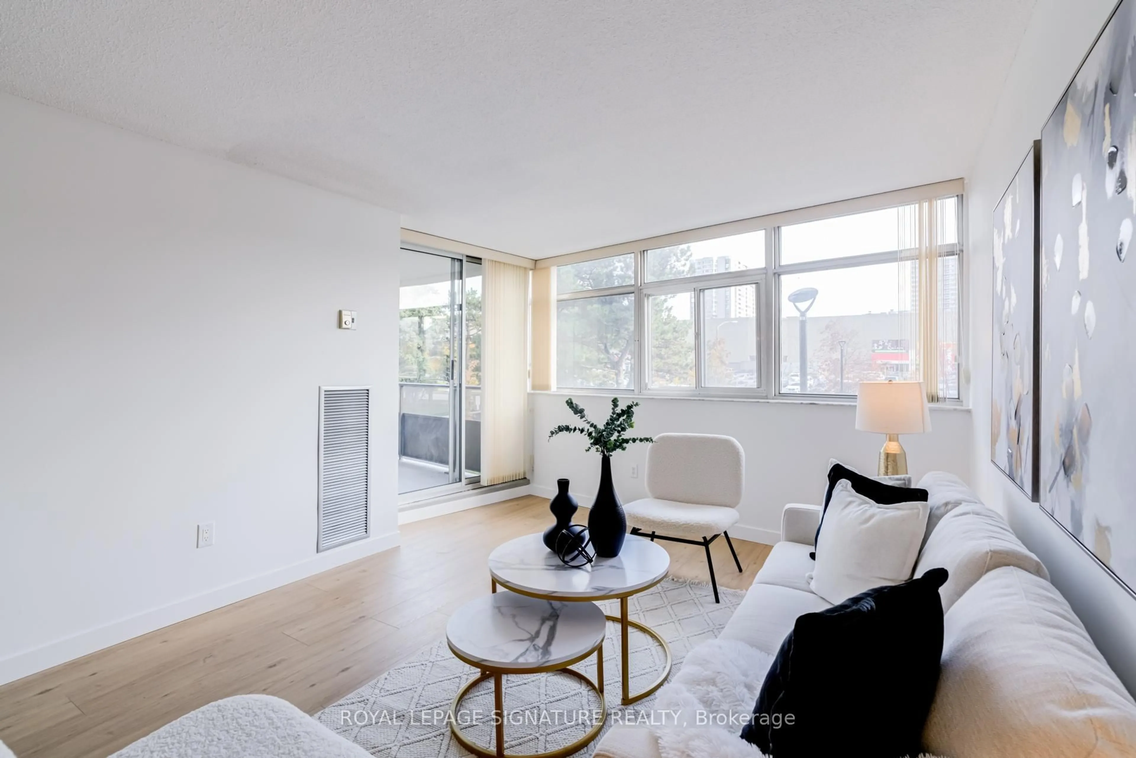 Living room with furniture, unknown for 3151 Bridletowne Circ #203, Toronto Ontario M1W 2T1