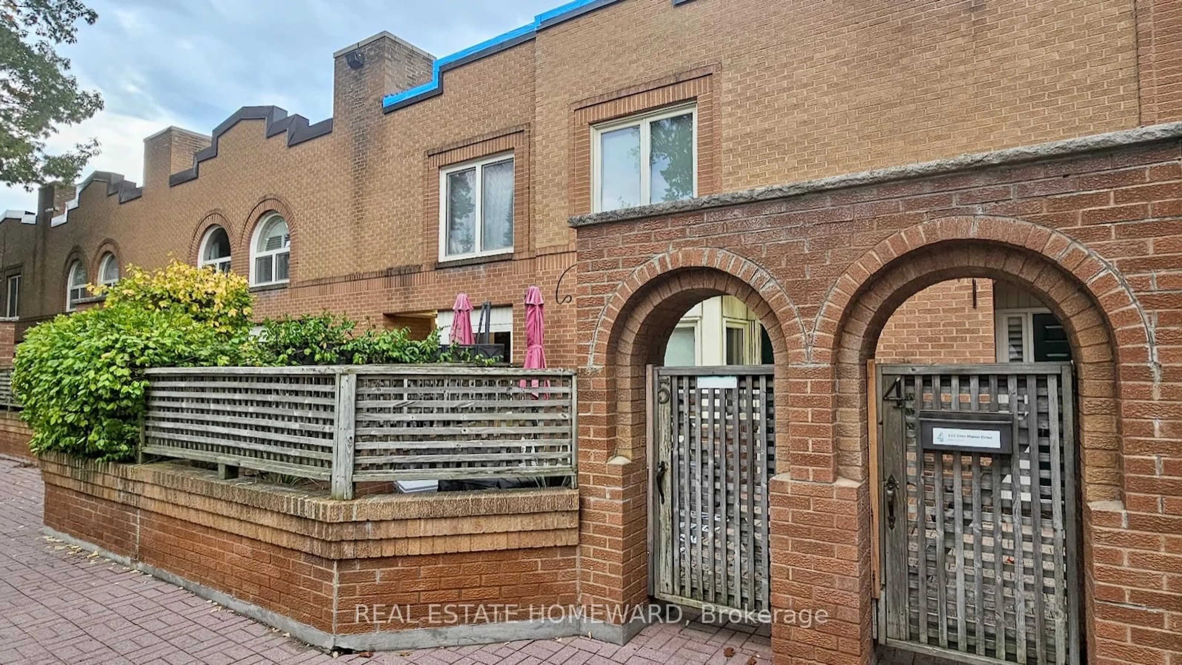 Home with brick exterior material, street for 122 Glen Manor Dr #5, Toronto Ontario M4E 2X6