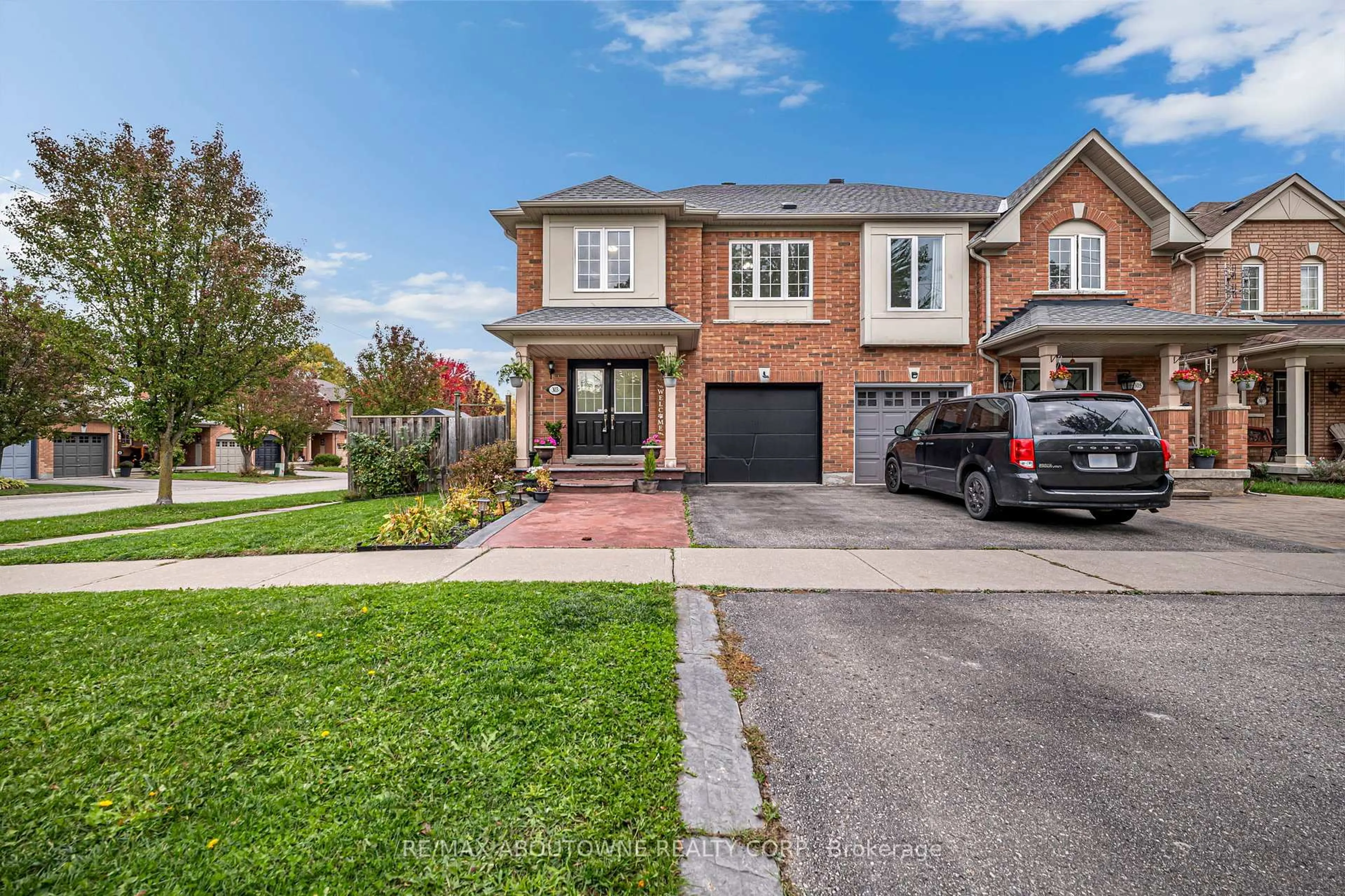 Home with brick exterior material, street for 303 Porte Rd, Ajax Ontario L1S 0A4
