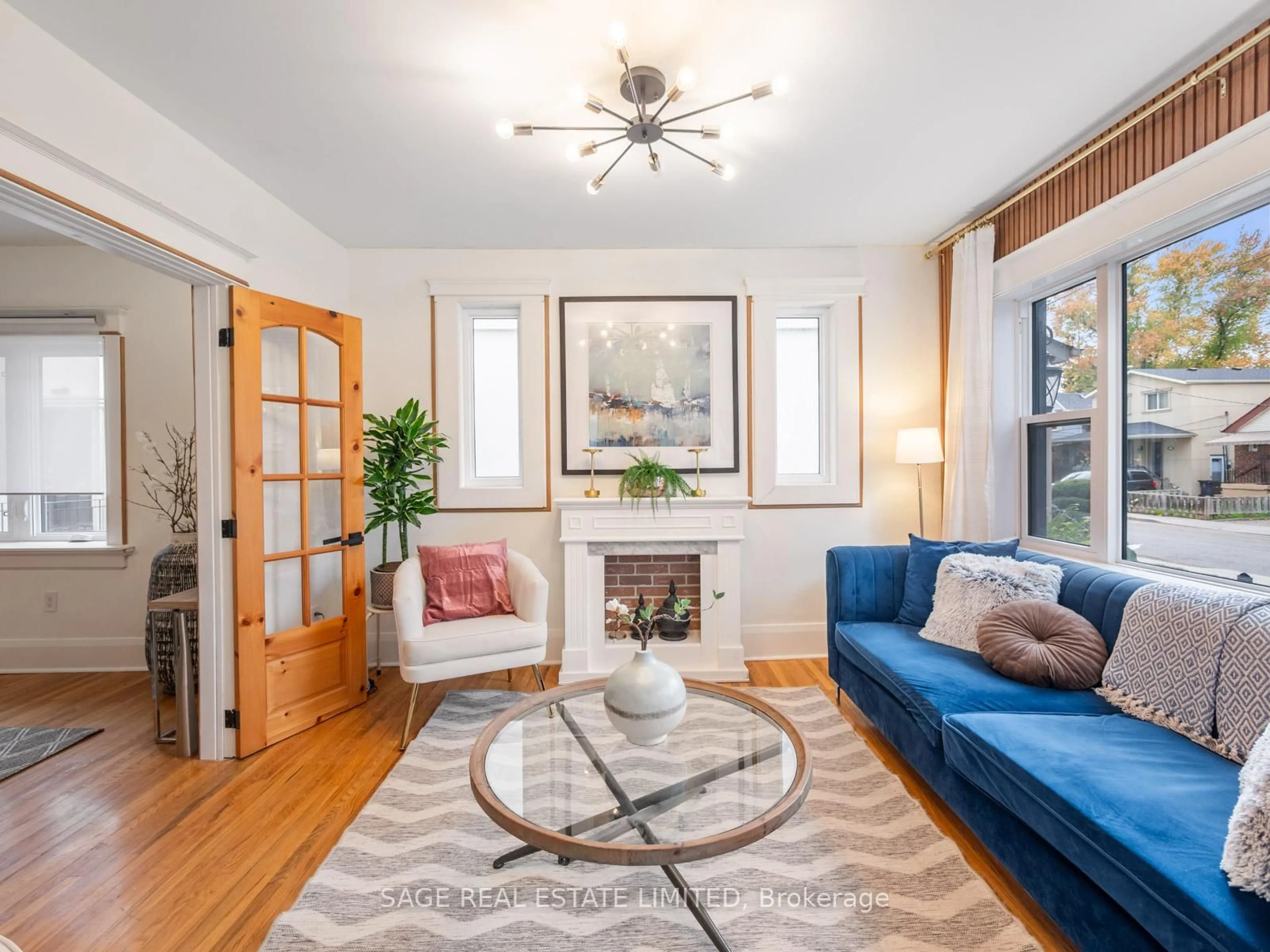 Living room with furniture, wood/laminate floor for 19 SAVOY Ave, Toronto Ontario M4C 2X4