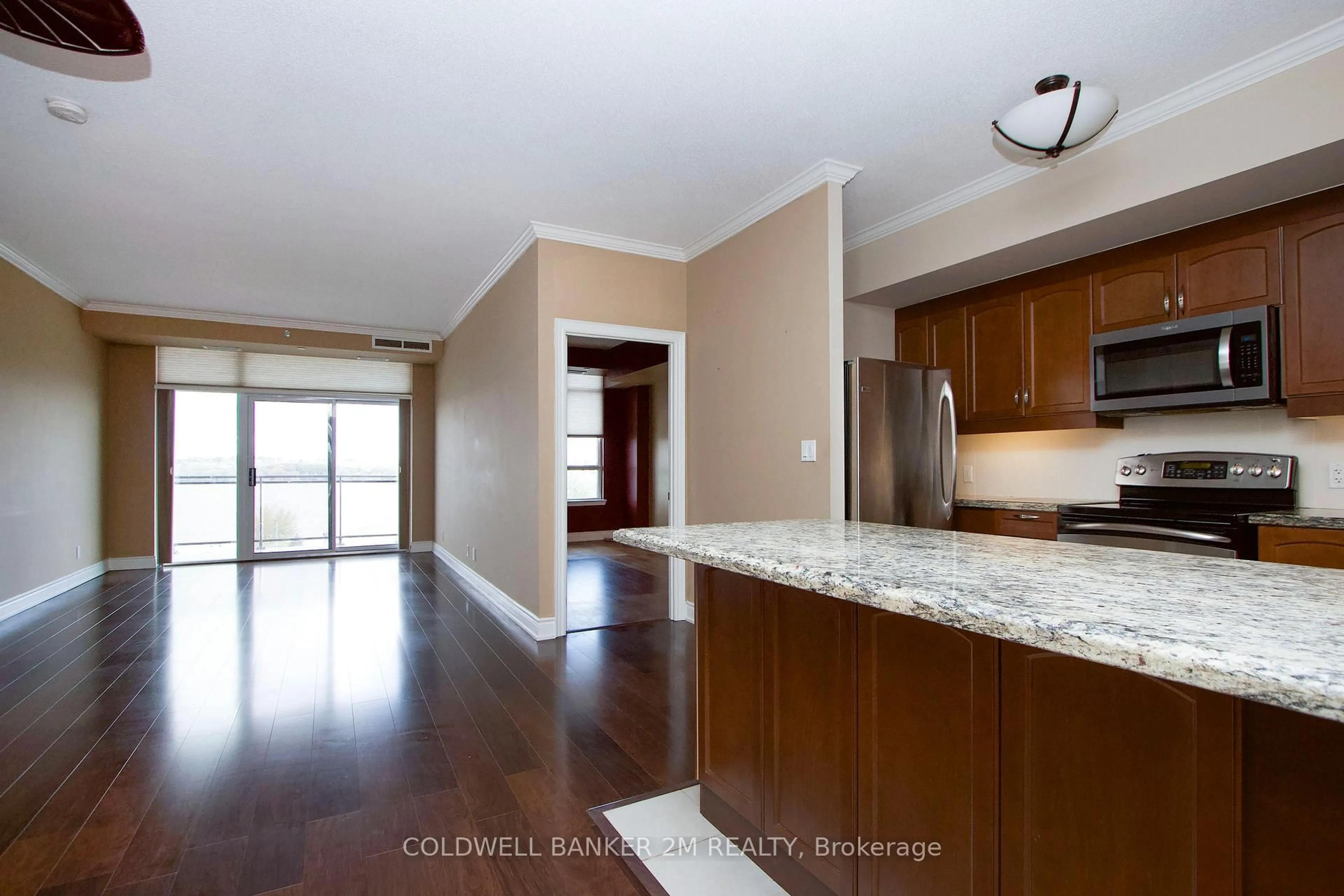 Open concept kitchen, wood/laminate floor for 171 Shanly St #507, Scugog Ontario L9L 0A3