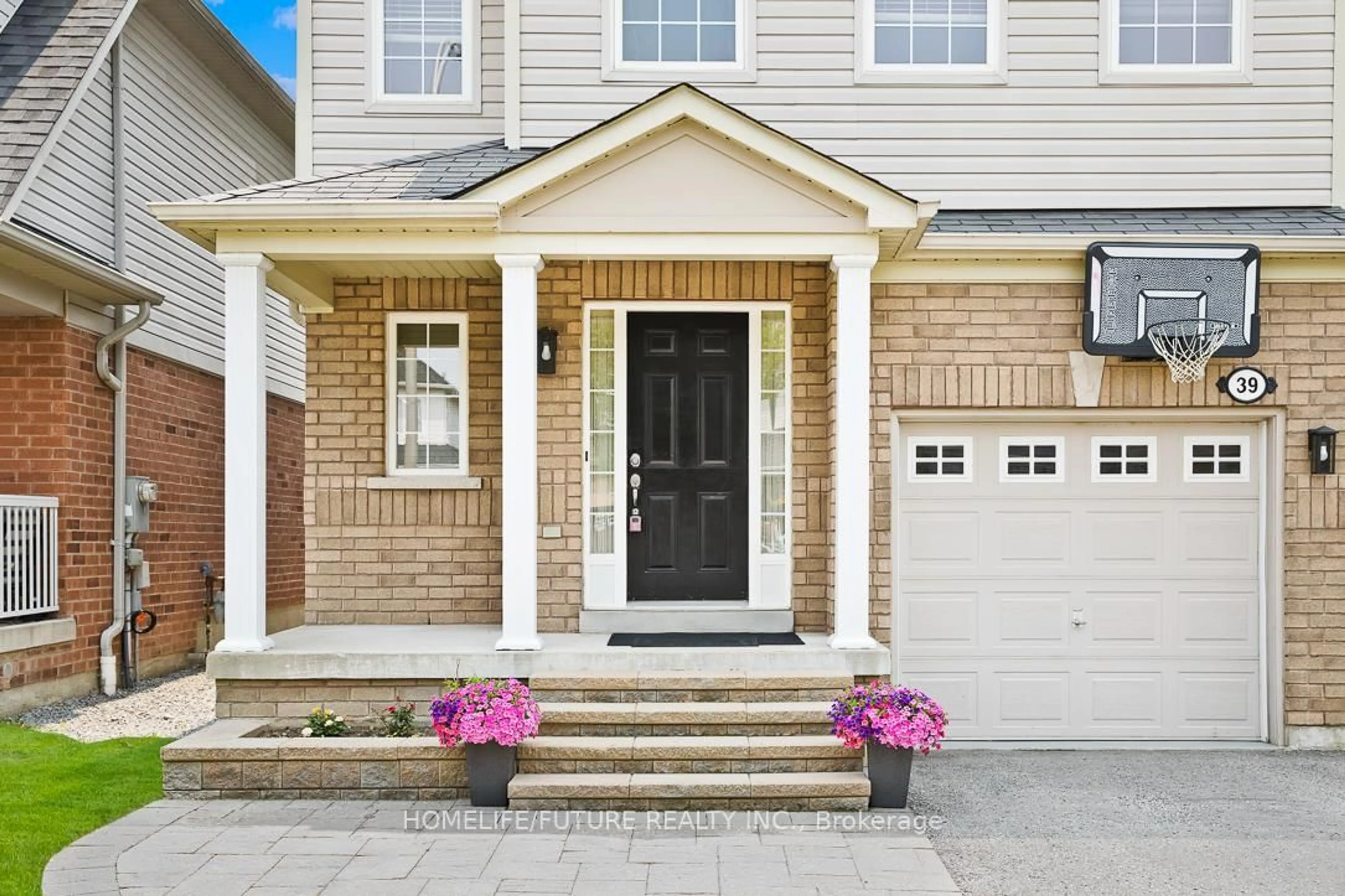 Home with brick exterior material, street for 39 Harkness Dr, Whitby Ontario L1R 0C5