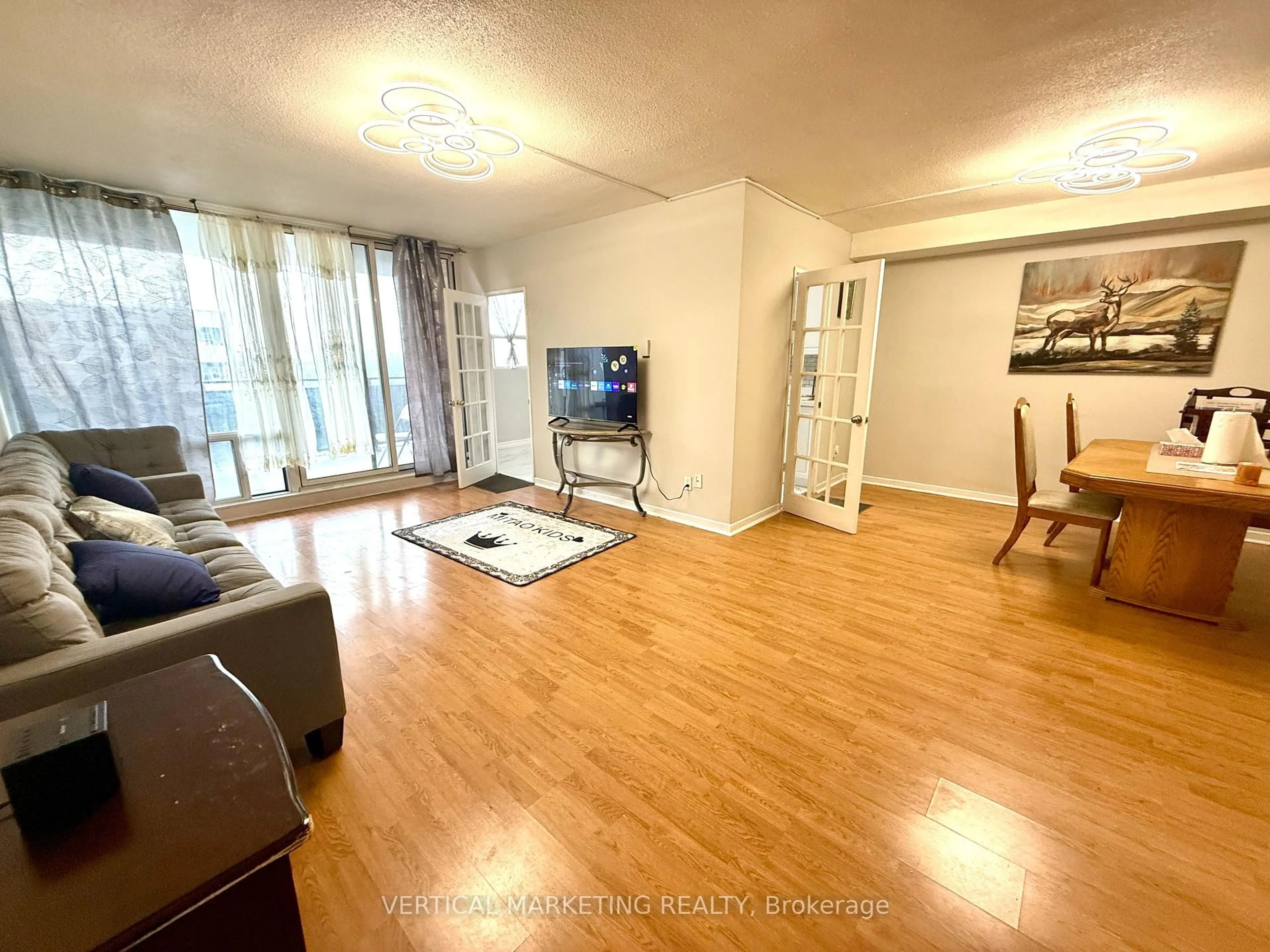 Living room with furniture, wood/laminate floor for 20 Gilder Dr #PH07, Toronto Ontario M1K 5E1