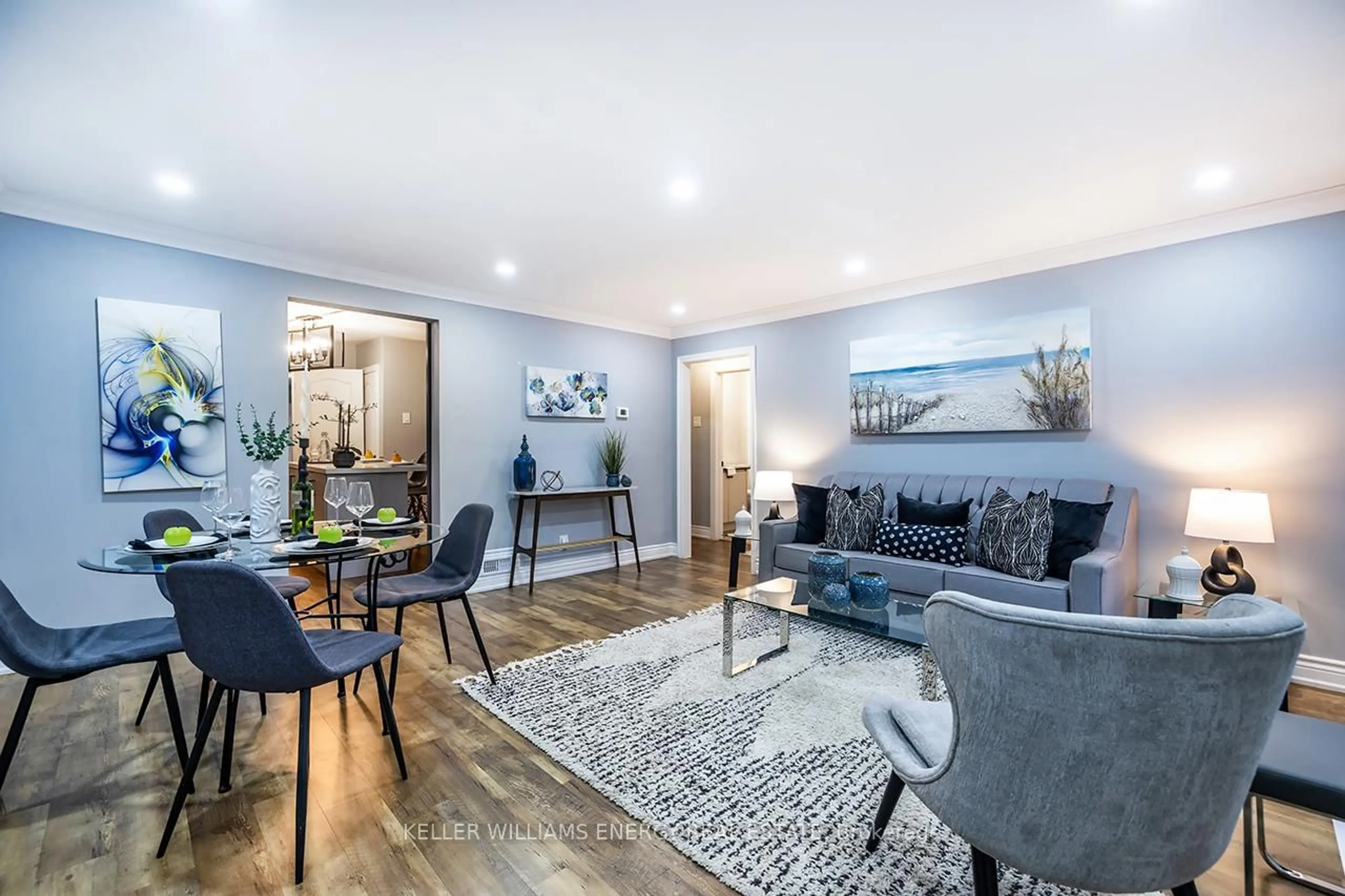 Living room with furniture, wood/laminate floor for 801 Gordon St, Oshawa Ontario L1H 4V8