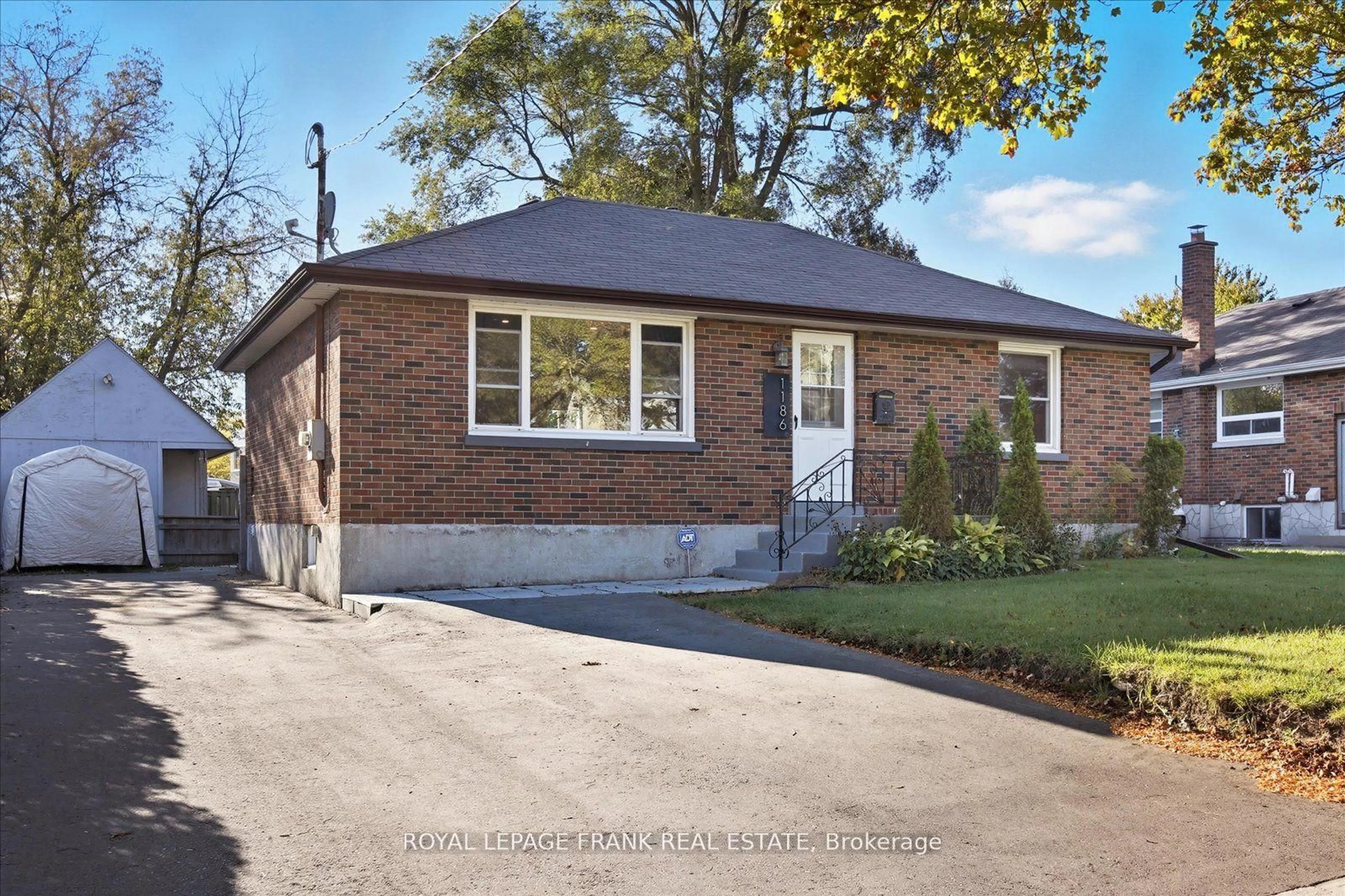 Home with brick exterior material, street for 1186 Ravine Rd, Oshawa Ontario L1H 4E2