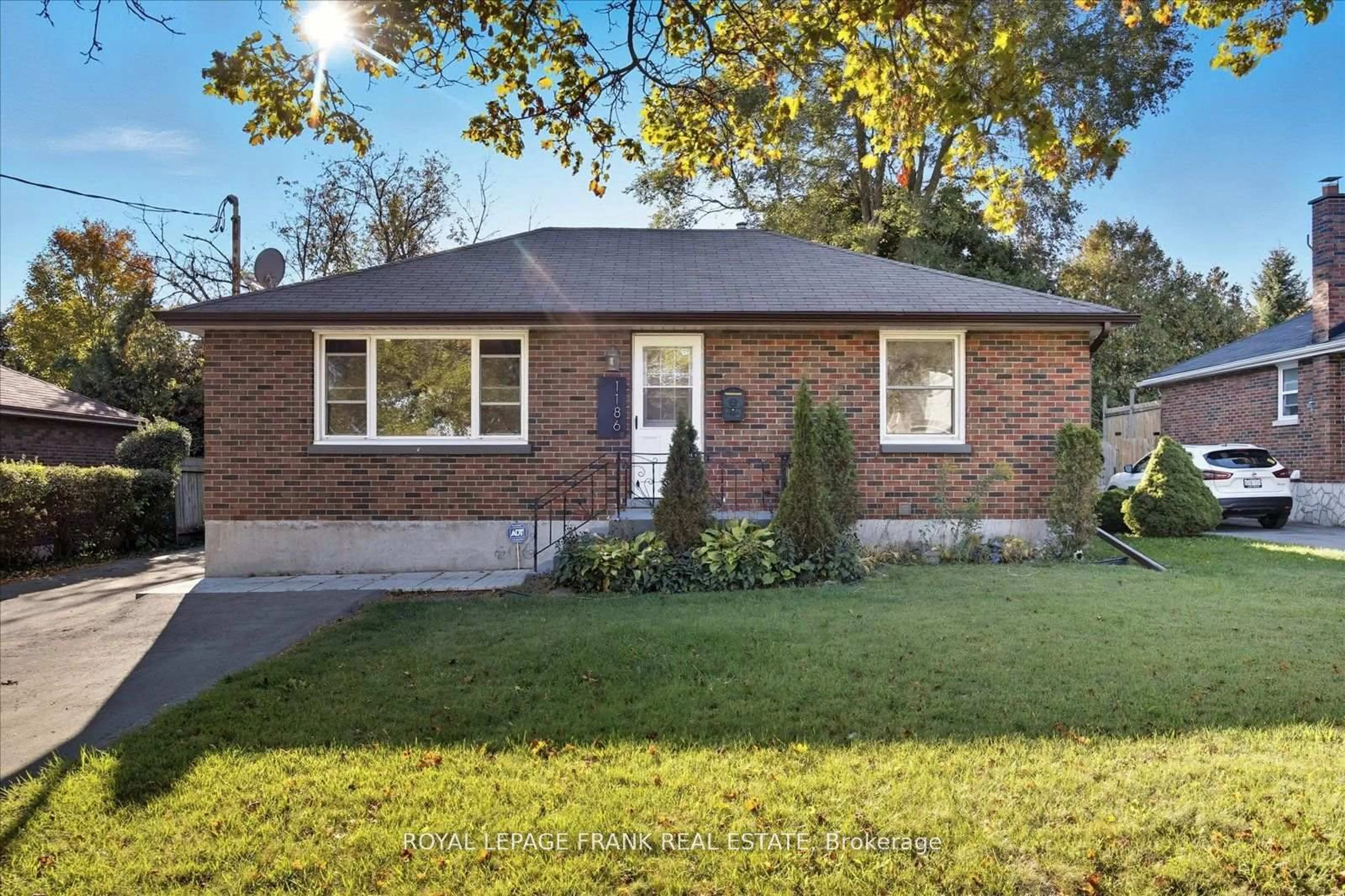 Home with brick exterior material, street for 1186 Ravine Rd, Oshawa Ontario L1H 4E2