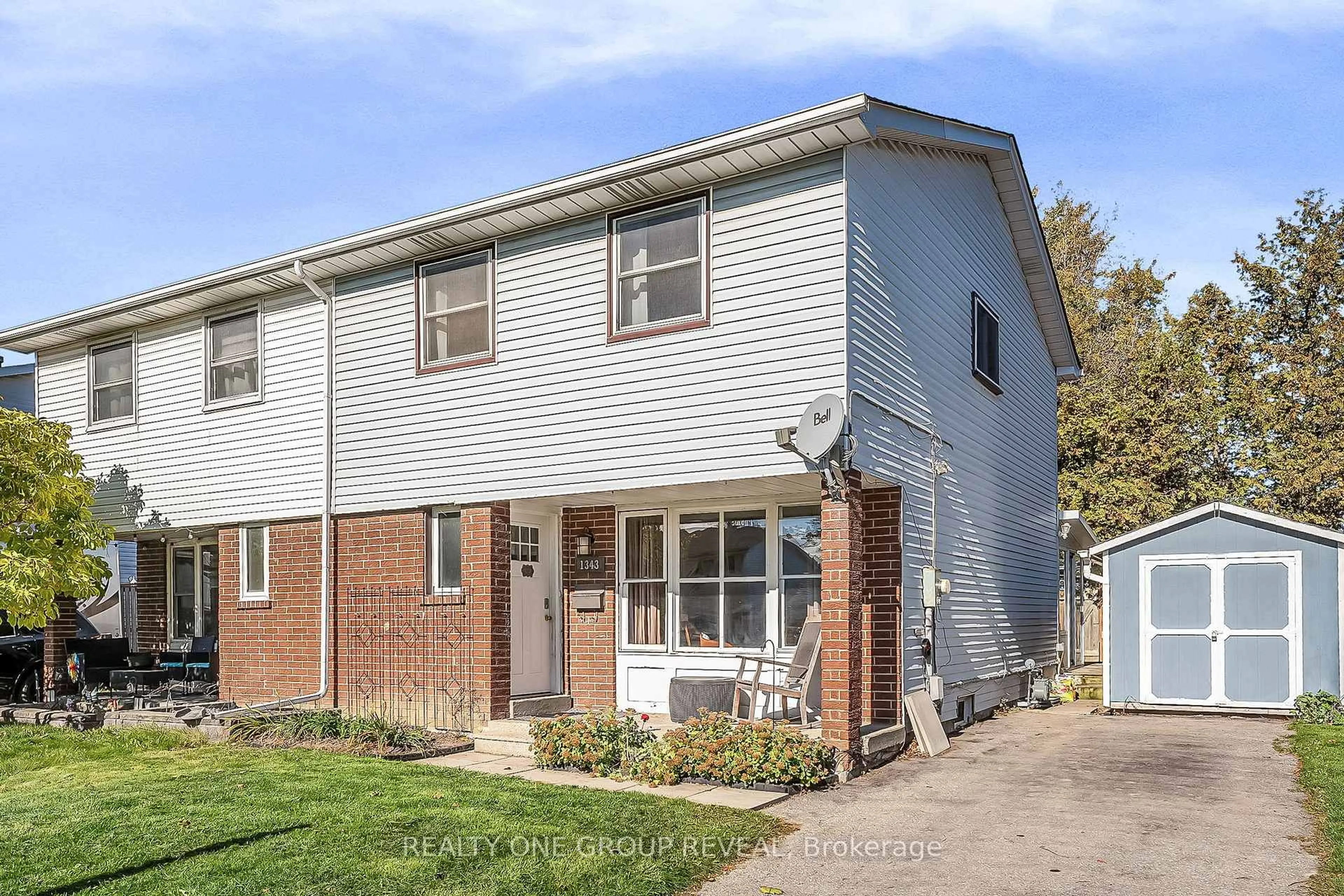 Home with brick exterior material, street for 1343 Fenelon Cres, Oshawa Ontario L1J 6G2