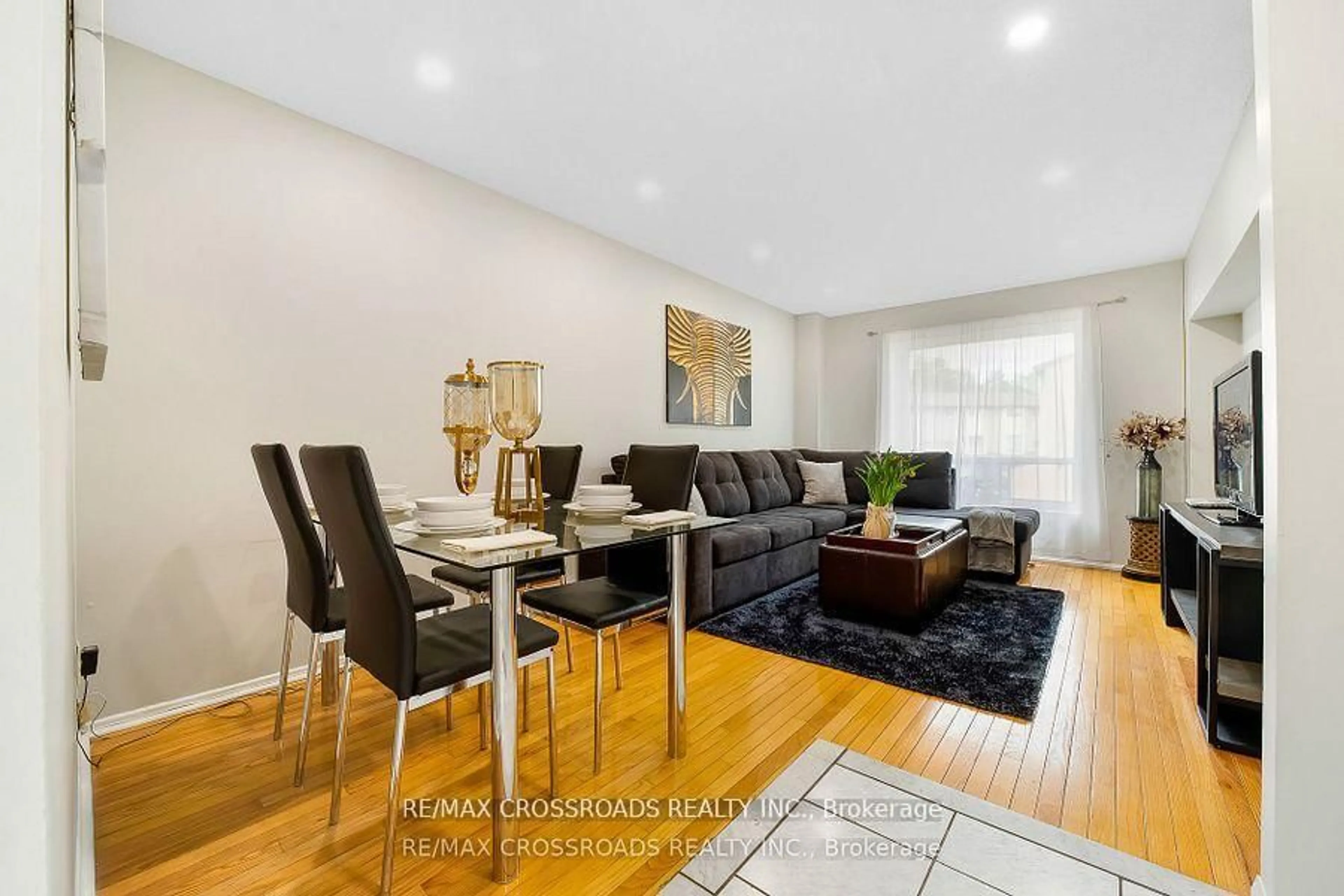 Living room with furniture, wood/laminate floor for 55 Collinsgrove Rd #299, Toronto Ontario M1E 4Z2